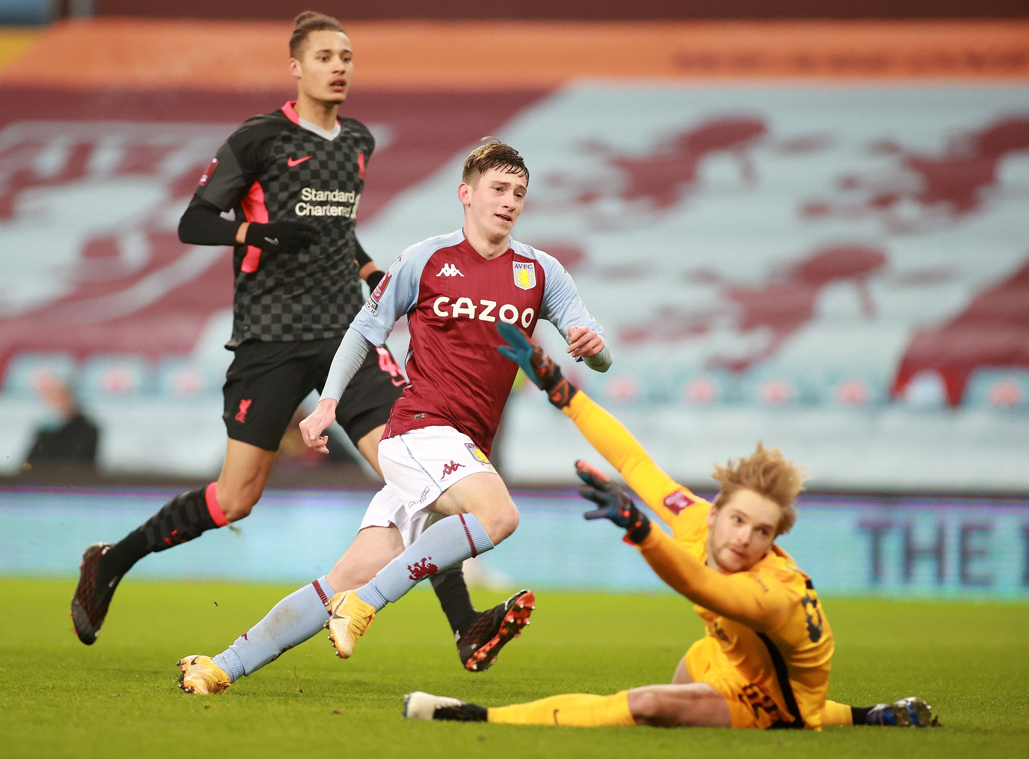 Aston Villa forward Louie Barry scores against Liverpool