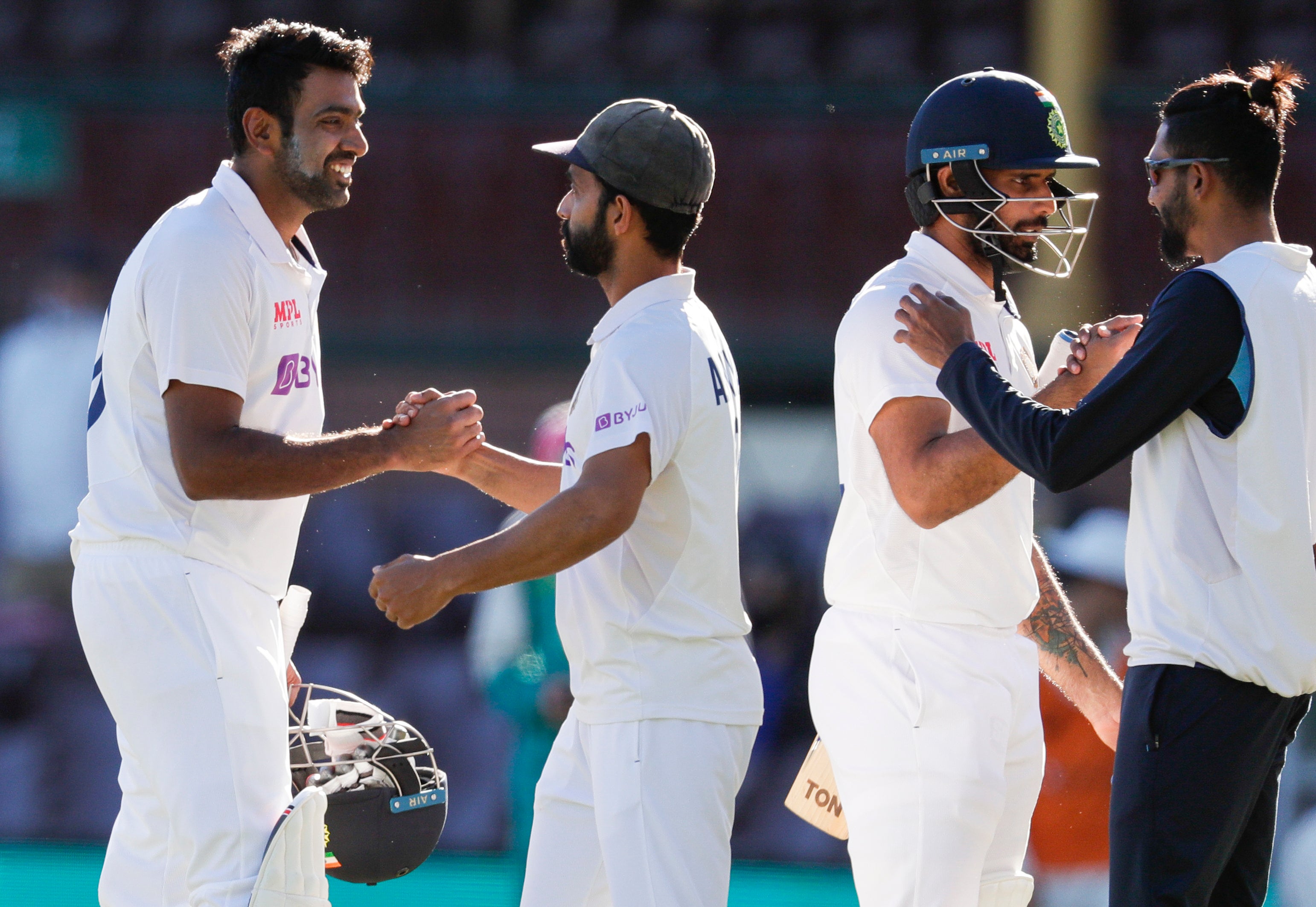 Indian players congratulate each other after securing a draw