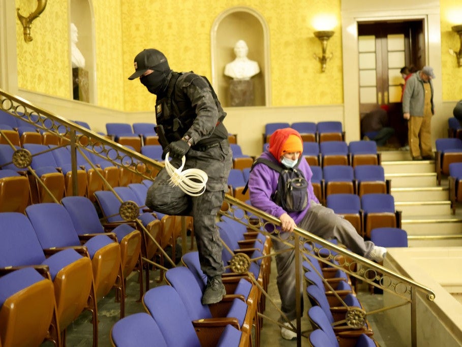 Protesters enter the Senate Chamber on 6 January, 2021 in Washington, DC