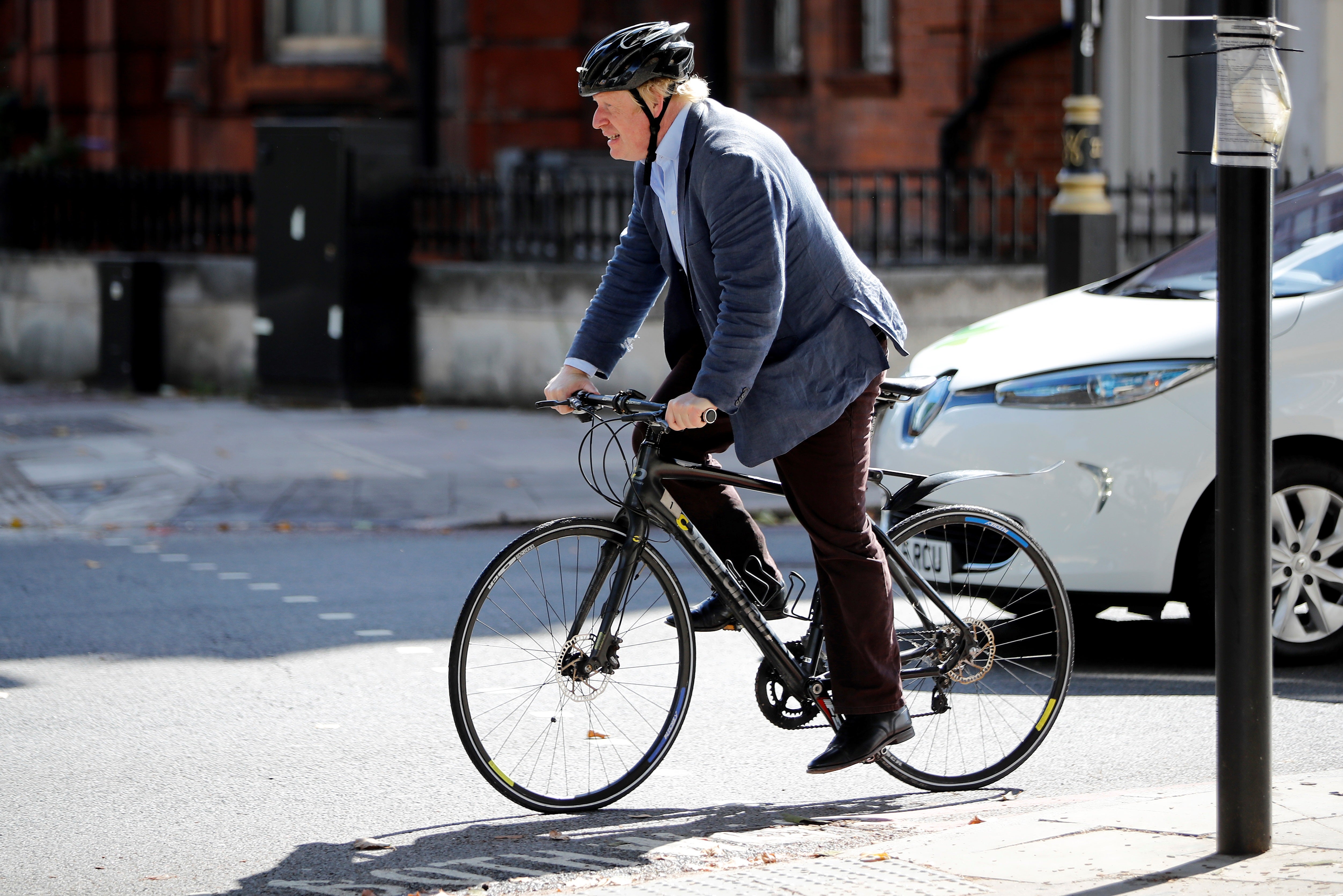 A file photo shows Boris Johnson out on his bike.&nbsp;