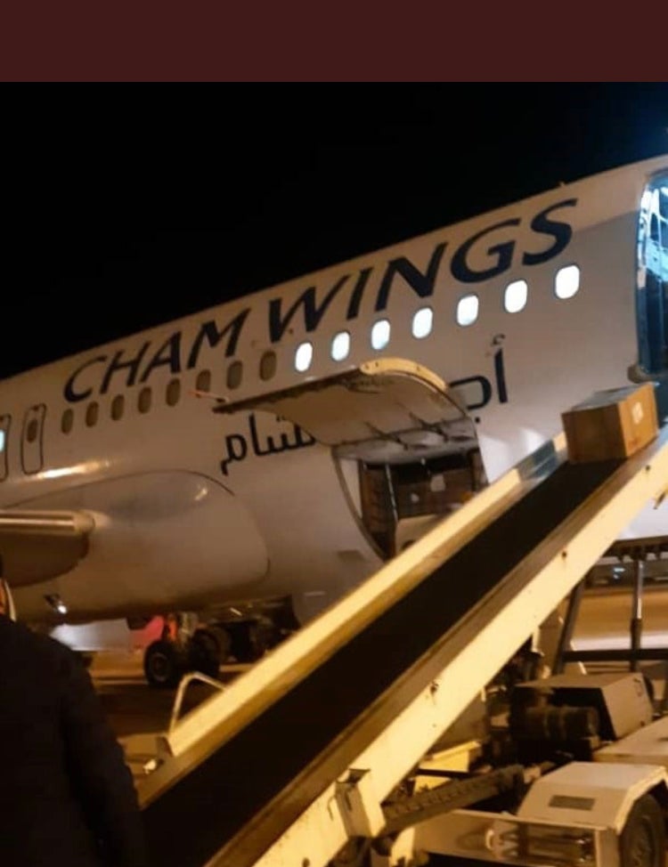 A Cham Wings plane delivering aid in Libya