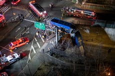 New York City bus left dangling from overpass after crash