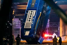 New York bus left dangling over bridge after crash