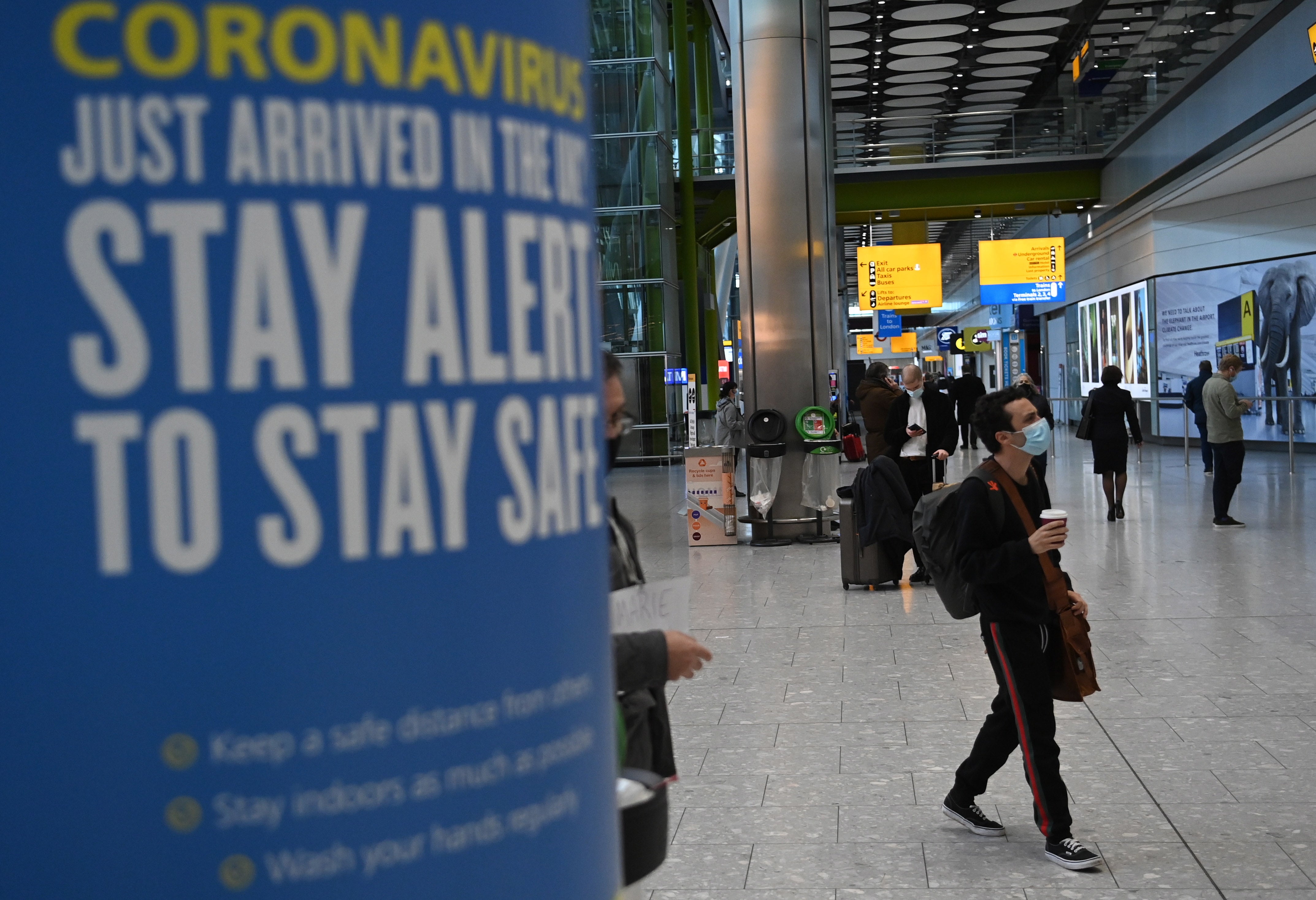 A “stay alert” coronavirus poster is pictured at Heathrow Airport on 15 January, 2021.