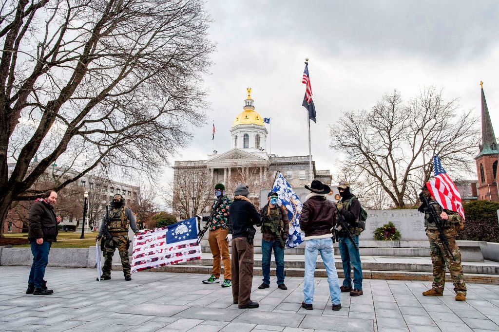 Armed protesters gather at state capitols of Ohio, Michigan, elsewhere