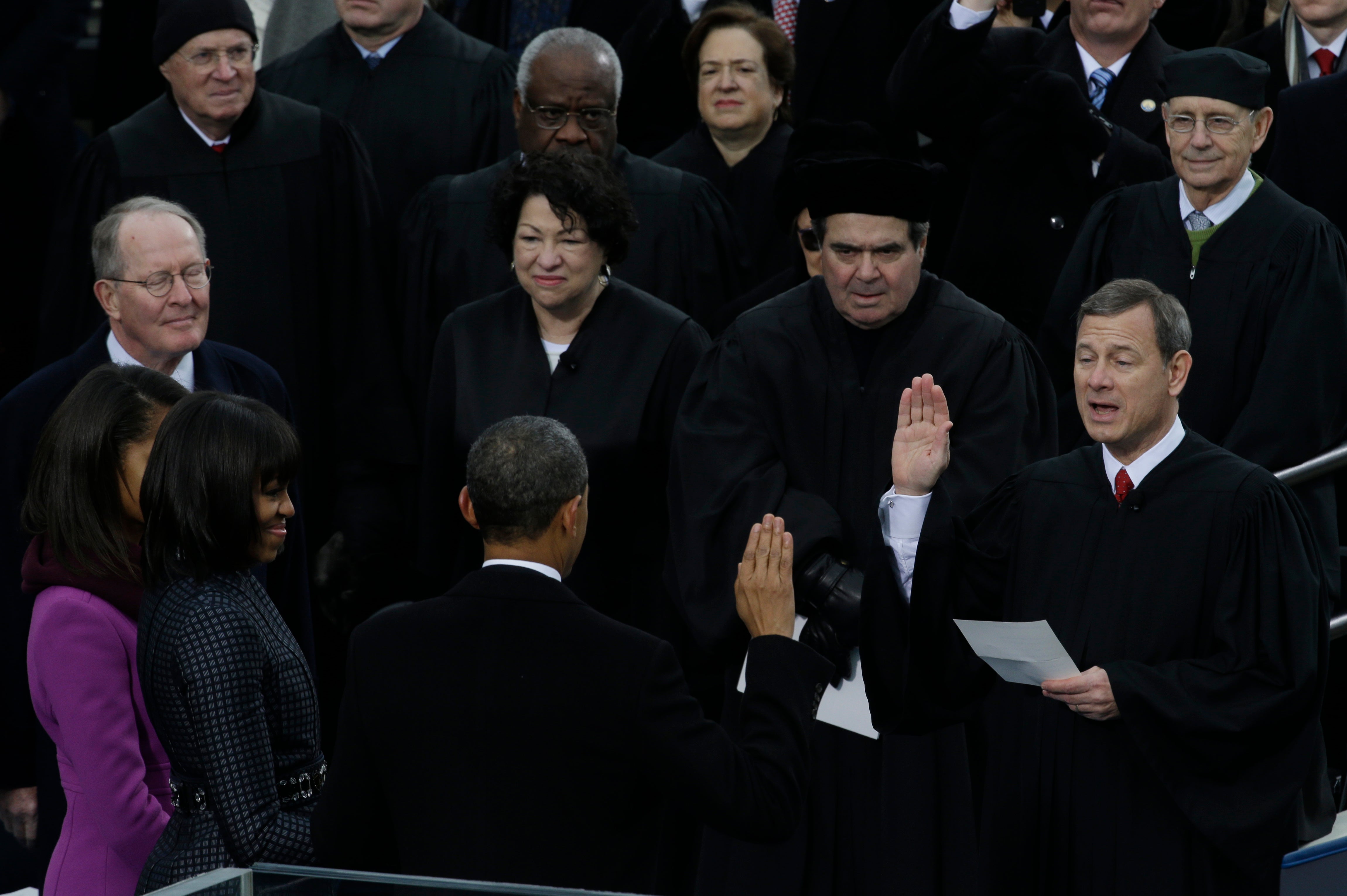 Chief Justice John Roberts, right, reads the oath of office to the former president at the ceremonial swearing-in at the US Capitol in 2013. Obama used King’s Bible in the ceremony