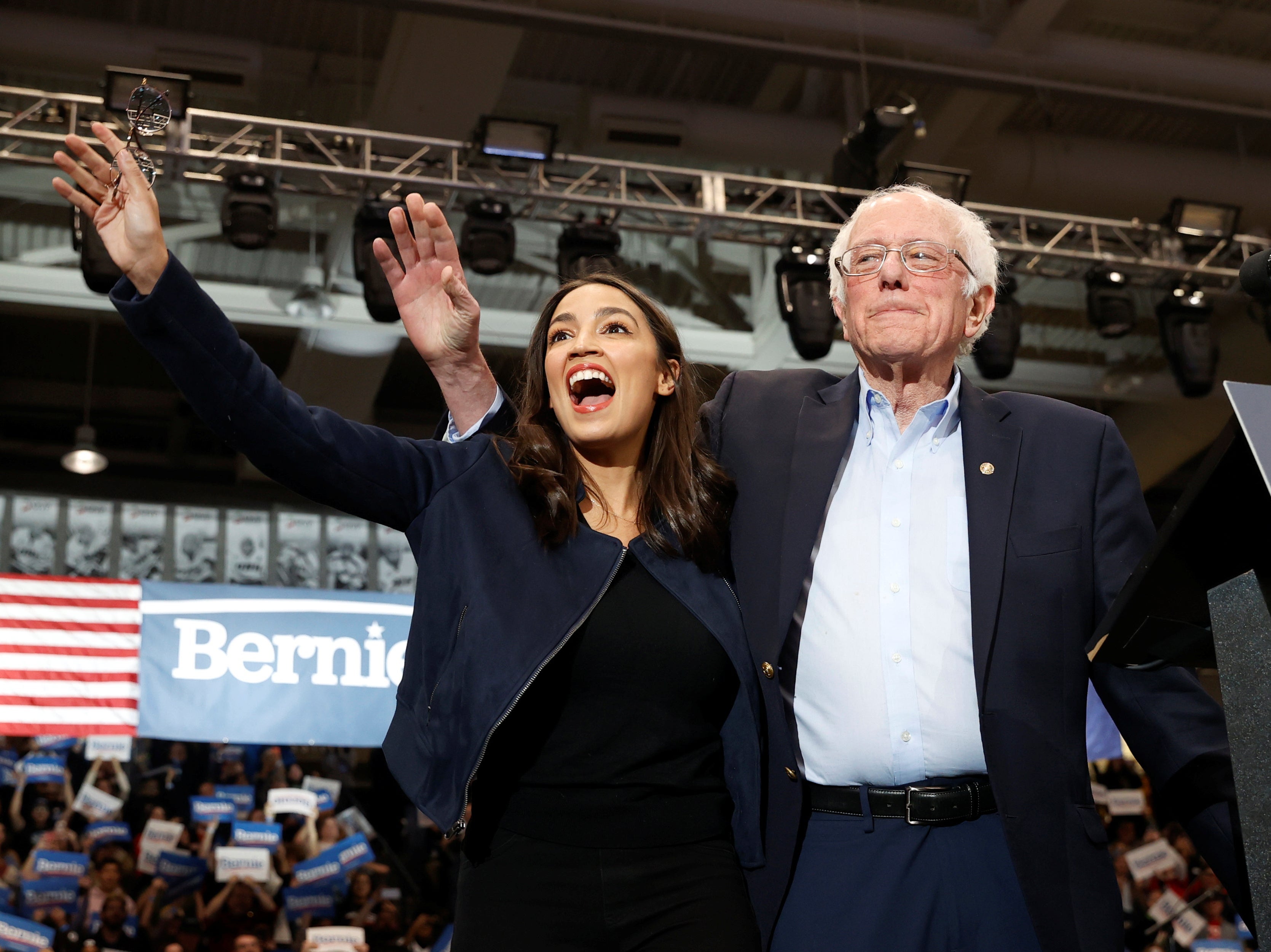 To the left: Alexandria Ocasio-Cortez and Bernie Sanders