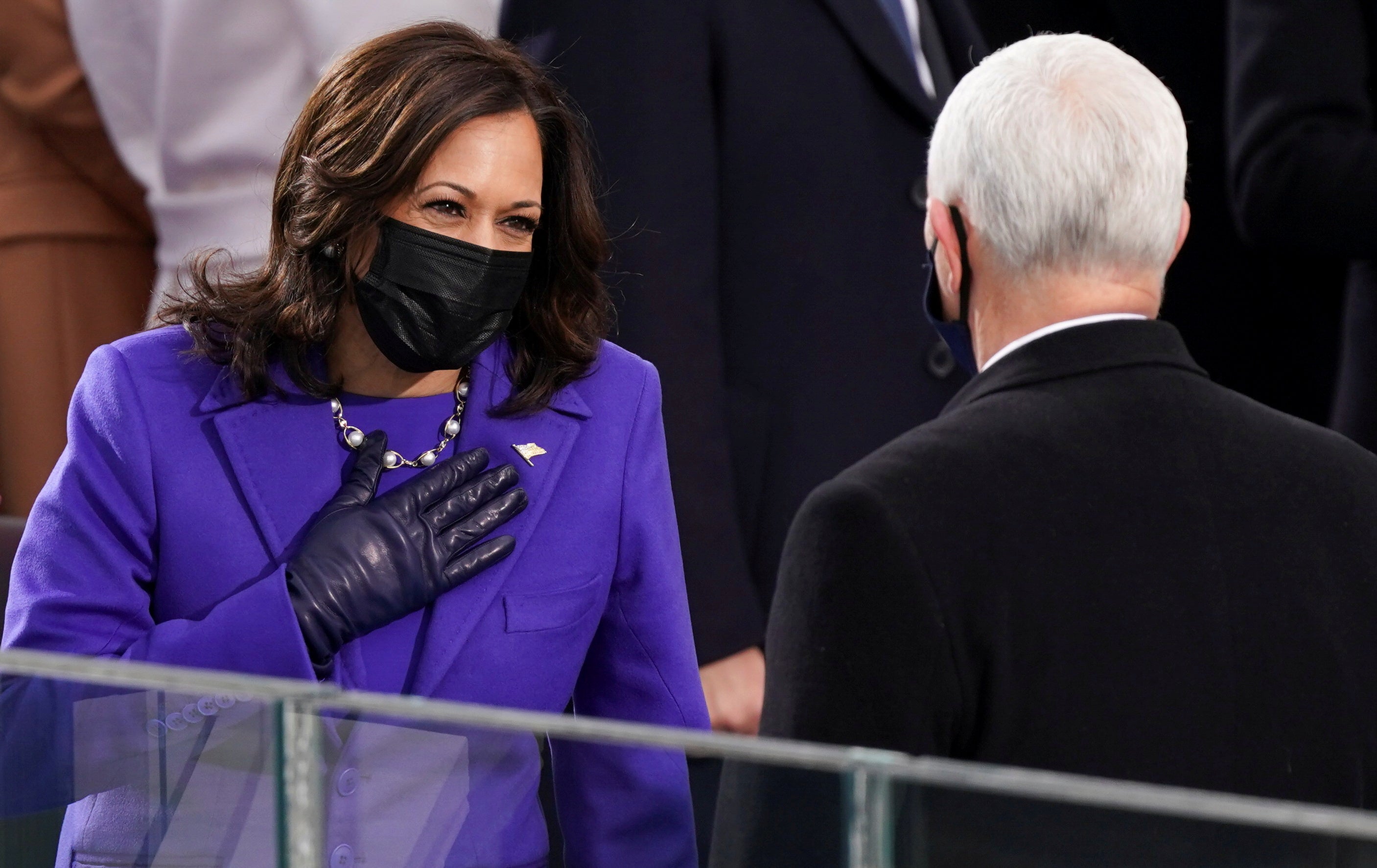 Kamala Harris gestures towards Mike Pence ahead of the inauguration