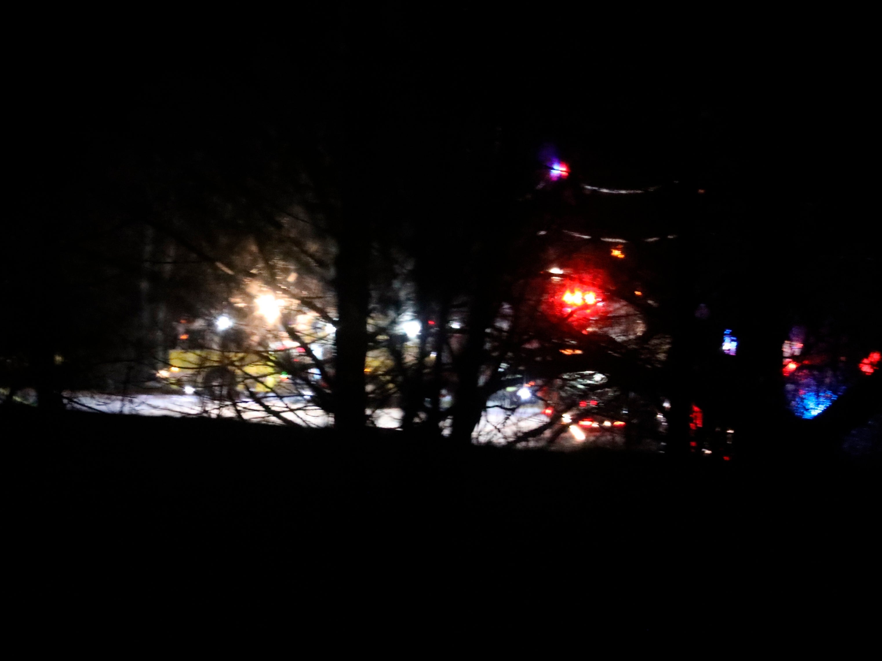 Mendon firefighters and other emergency personnel respond to a military helicopter crash in a field near Cheese Factory Road and W. Bloomfield Road in Mendon, New York