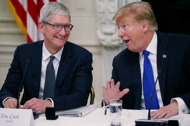 <p>Tim Cook laughs with Donald Trump at the White House in 2019. The Apple CEO intends to donate $1 million to Trump’s second inauguration, according to a report </p>