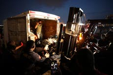 Relatives of plane's victims cast flowers into Indonesia sea