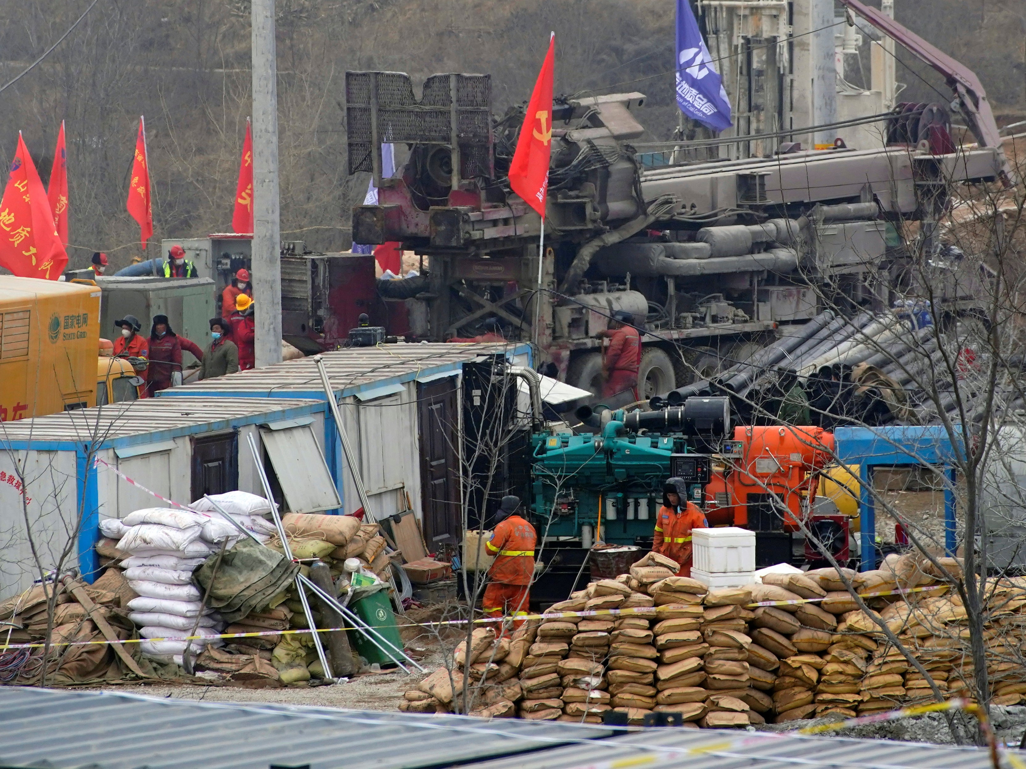 Rescuers work at the Hushan gold mine where workers were trapped underground after the Jauary 10 explosion, in Qixia, Shandong province