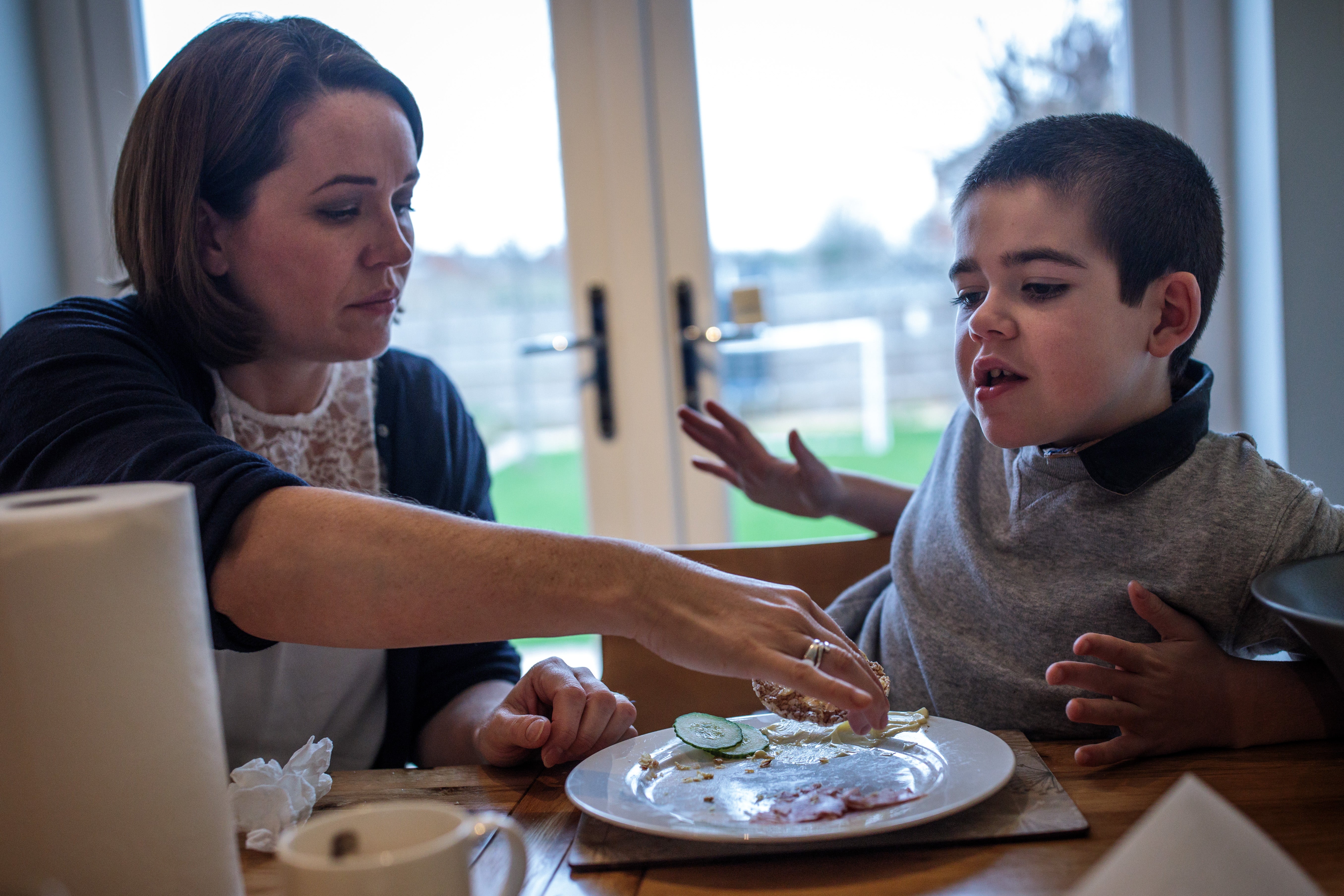 Alfie Dingley with his mother Hannah Deacon at their home in Kenilworth