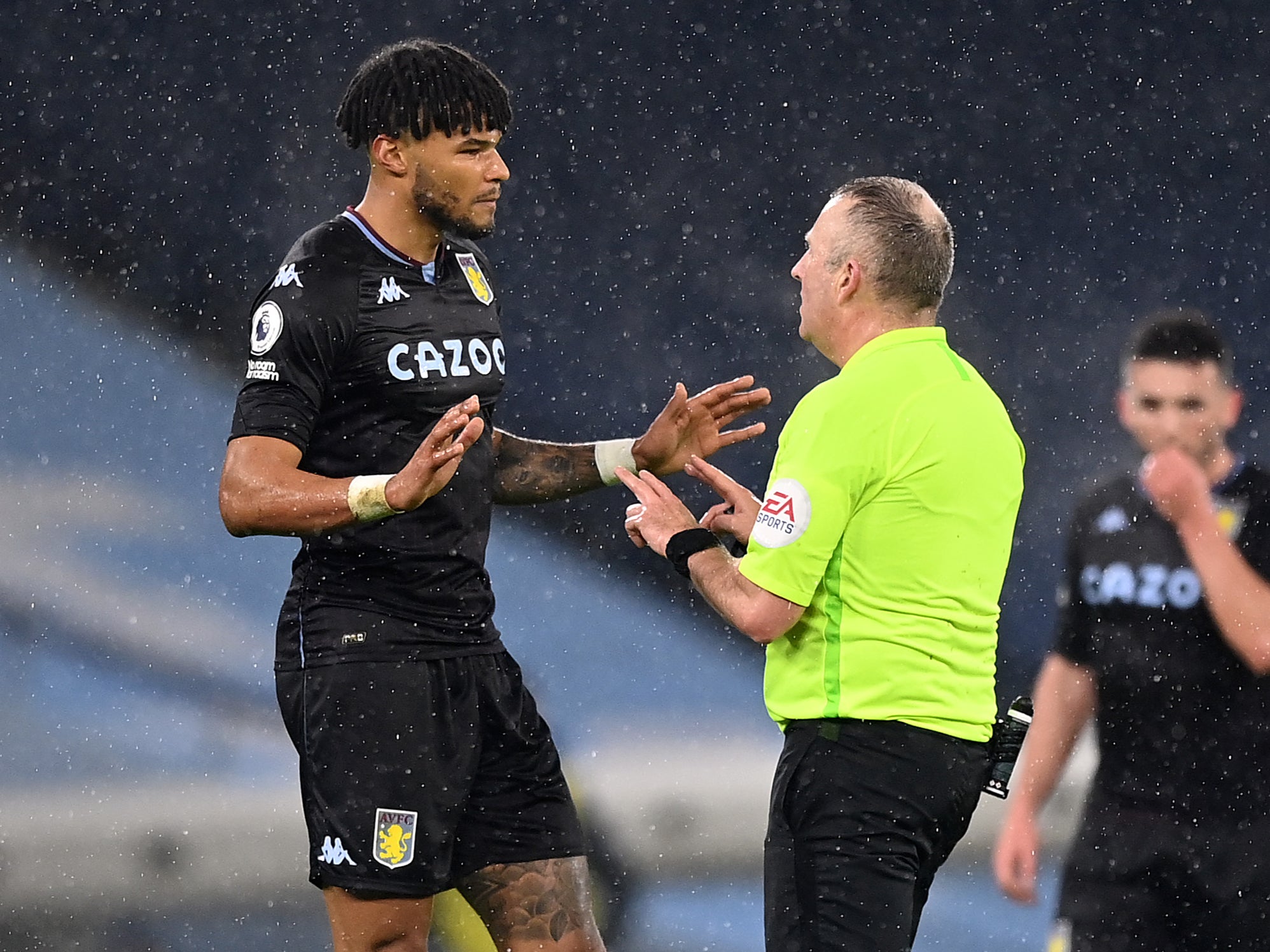 Aston Villa defender Tyrone Mings protests to referee Jonathan Moss