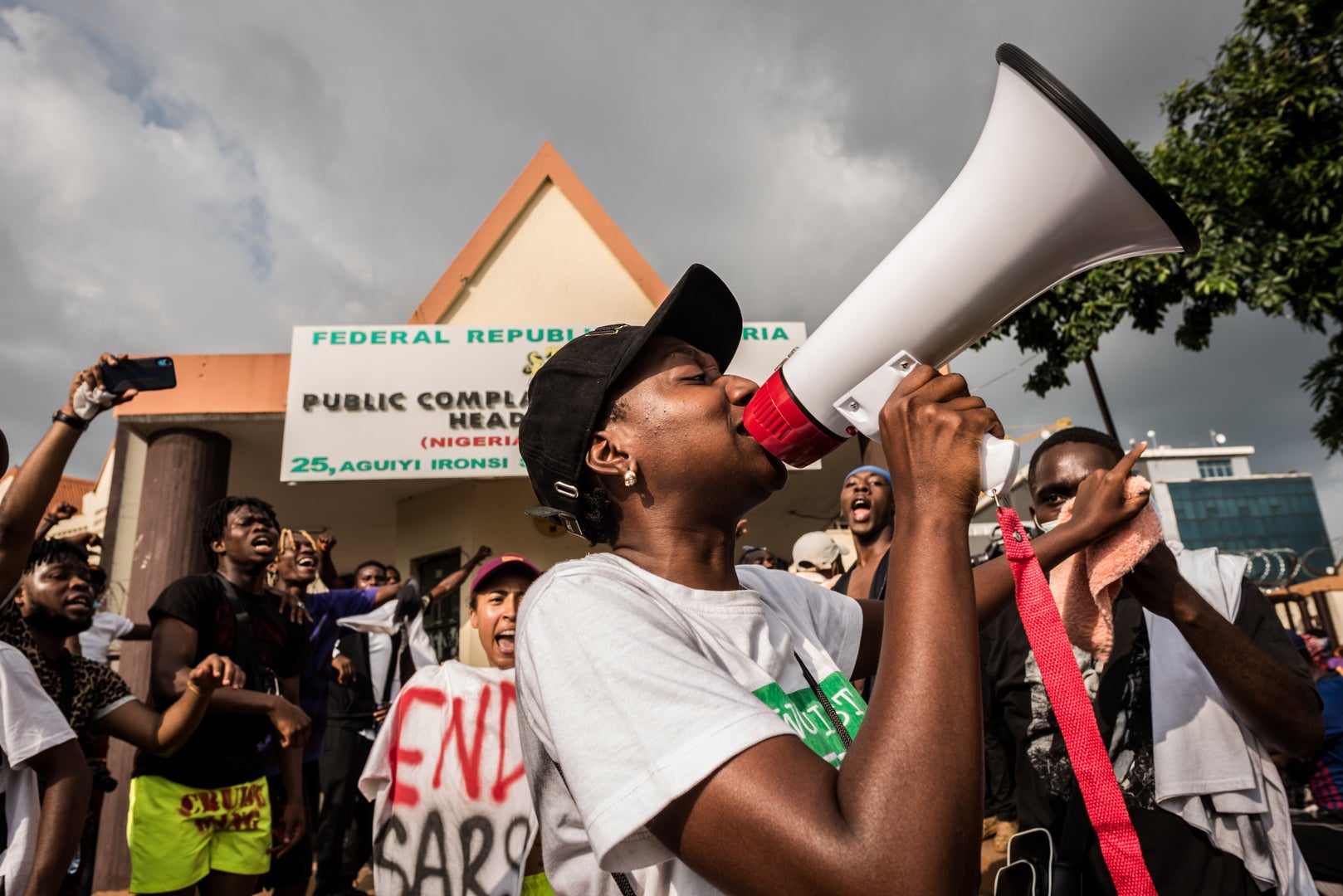 Protesters call out management and staff of the public complaint commission during the #EndSARS protest in Abuja