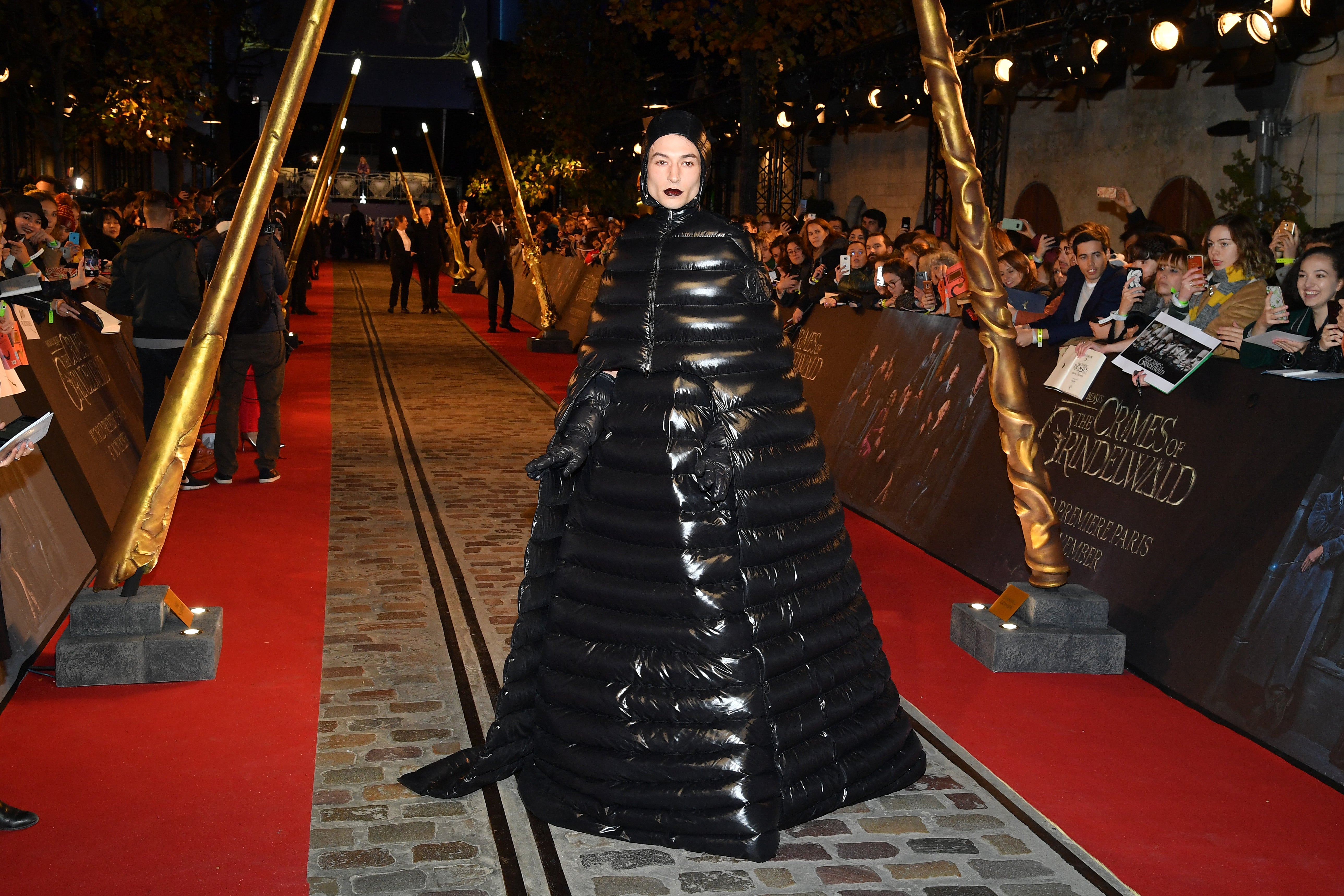 Ezra Miller in Moncler x Pierpaolo Piccioli puffer outfit at the Fantastic Beasts: The Crimes Of Grindelwald premiere, 2018