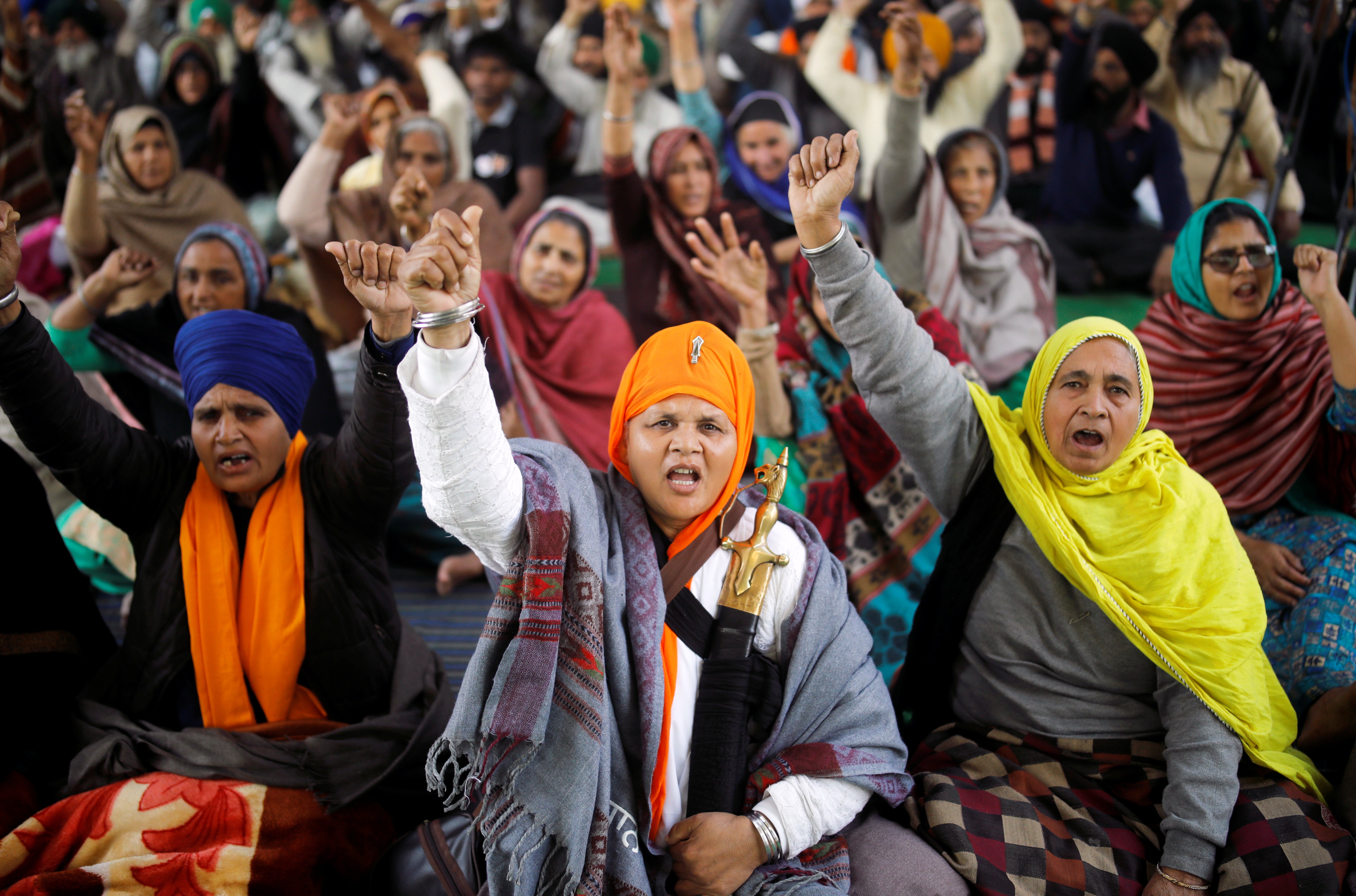 Farmers protest against the farm laws at Singhu border near New Delhi, on 30 January