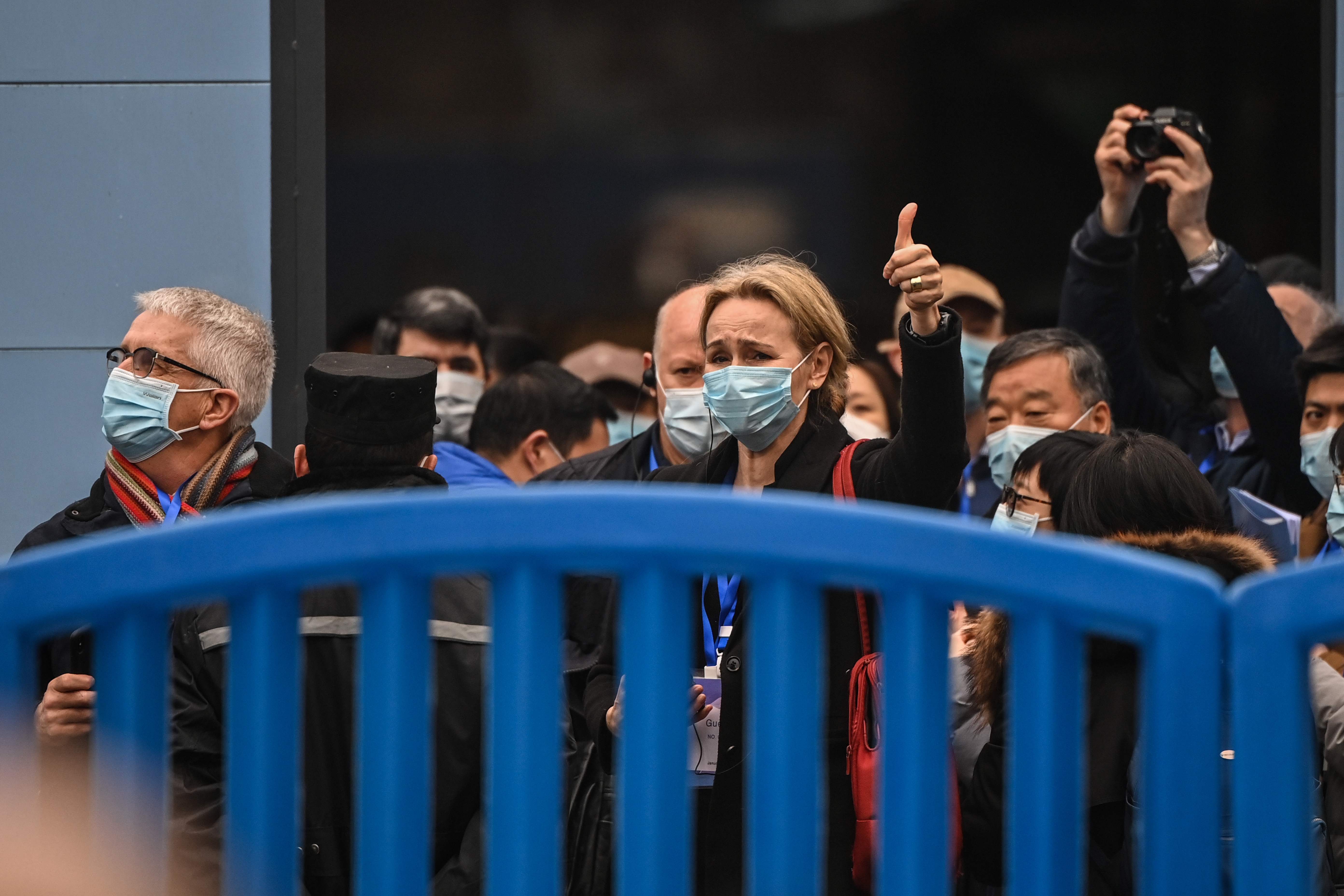 Thea Fisher (centre) and other members of the WHO visit the closed Huanan Seafood Market