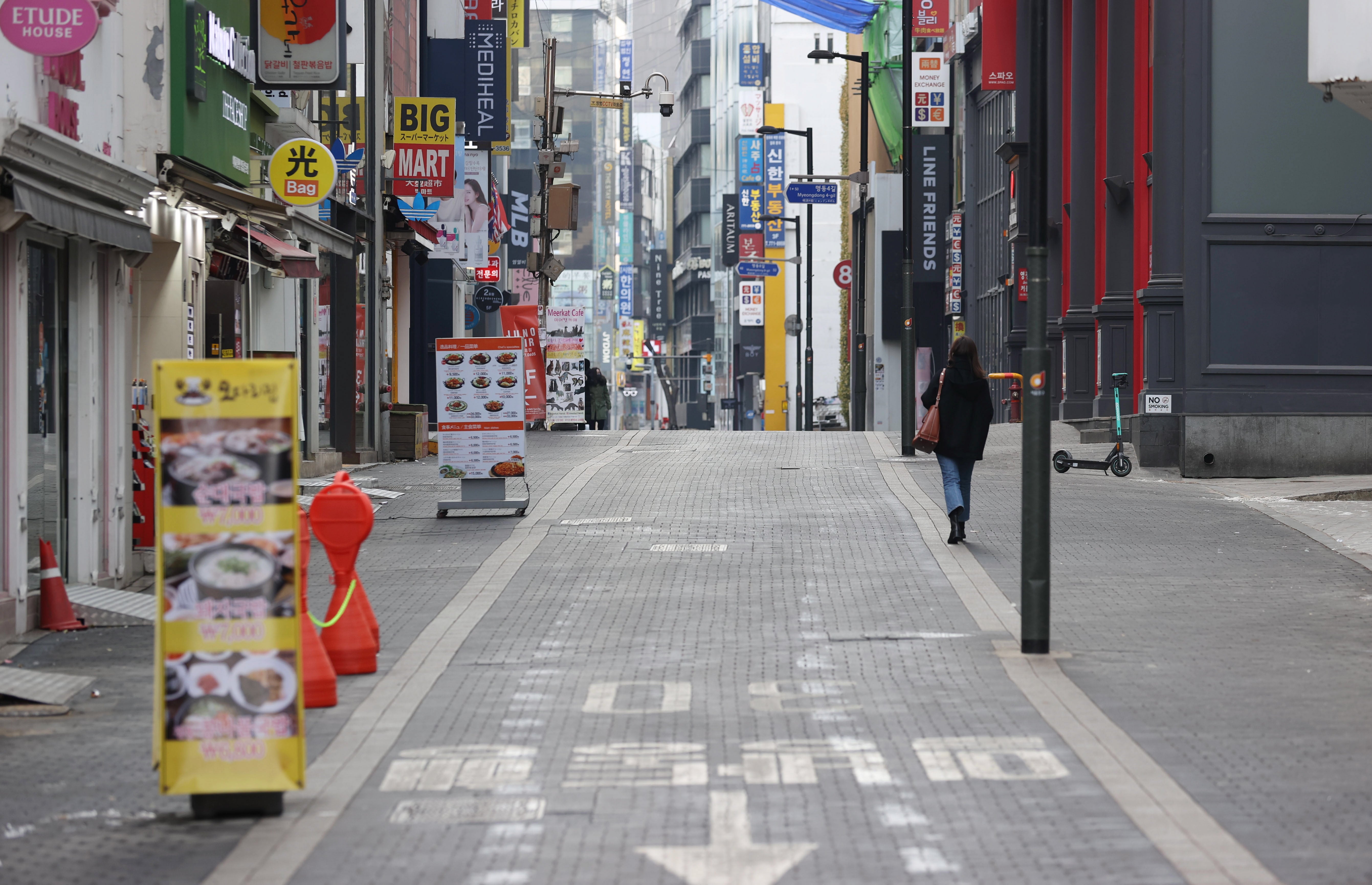 Streets in the Myeongdong shopping district of Seoul remain empty amid the ongoing pandemic