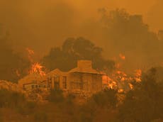 Australia urges thousands to abandon Covid lockdown as bushfire threatens Perth