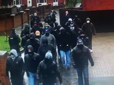 Images of ‘sinister’ masked men patrolling Belfast streets investigated by police