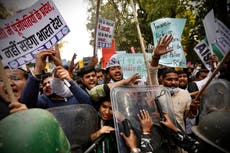 Supporters of protesting Indian farmers scuffle with police