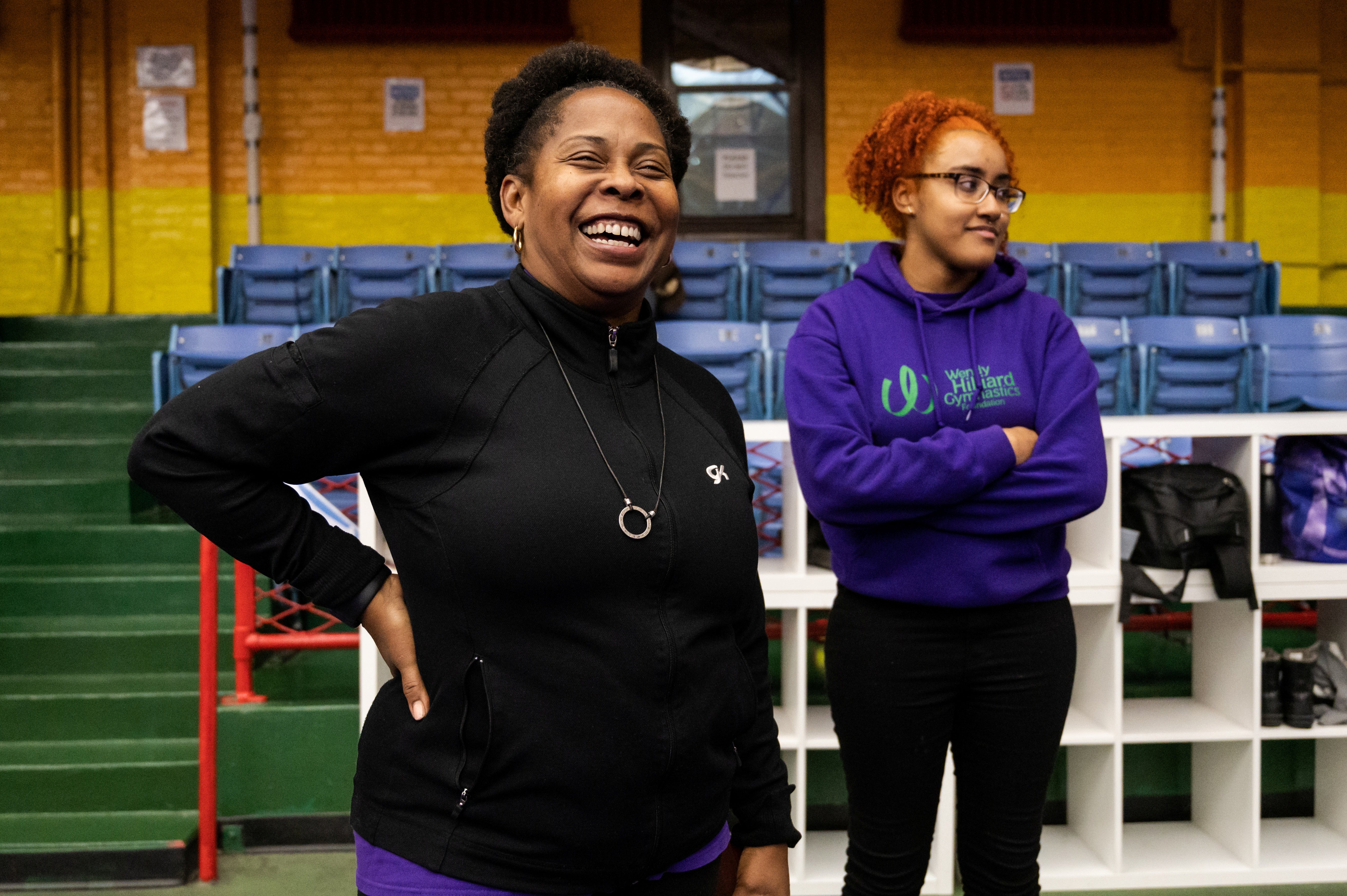 Wendy Hilliard and Zariah Hayes watch gymnasts