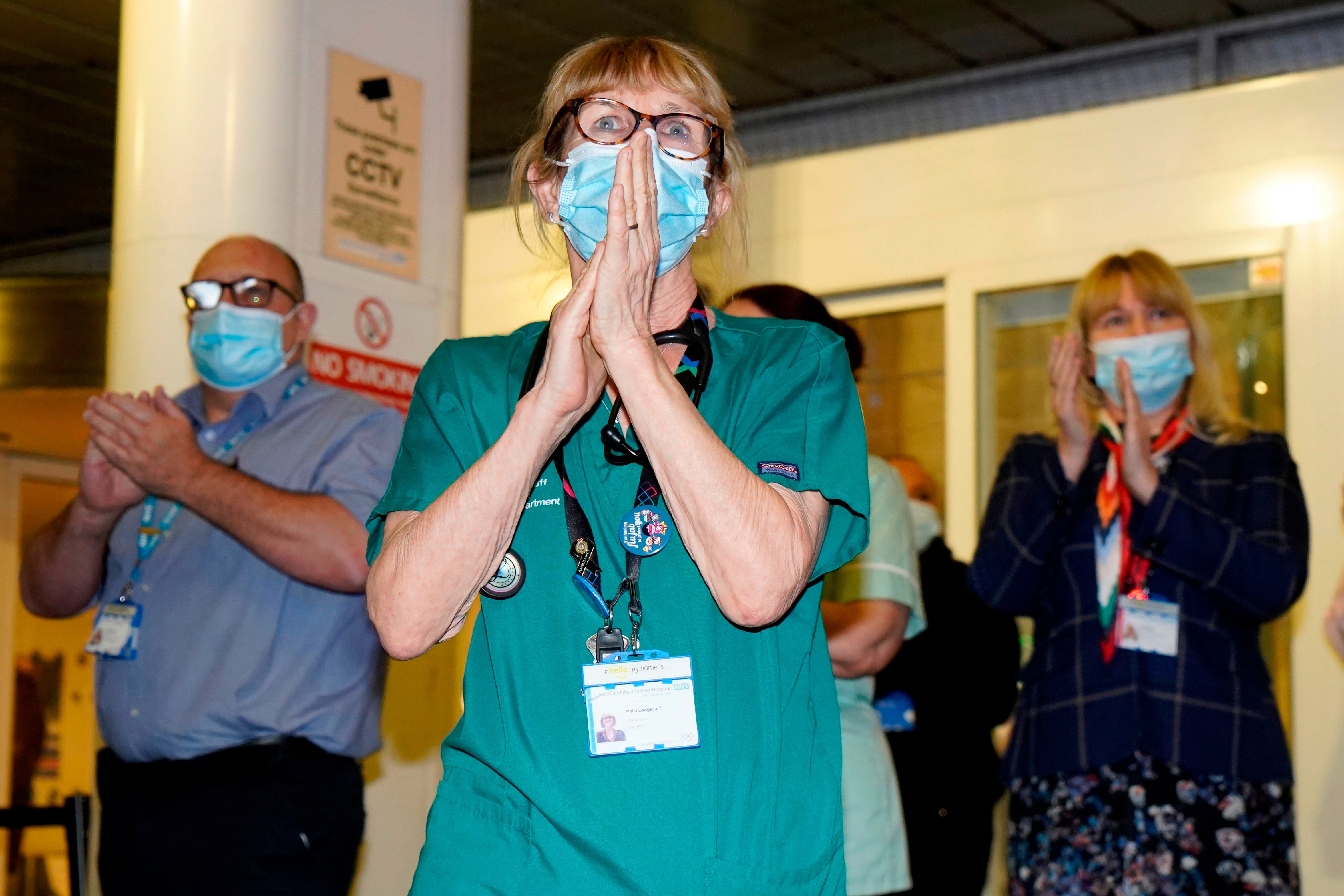 Members of staff at the Chelsea and Westminster Hospital take part in the Clap for Captain Tom Moore