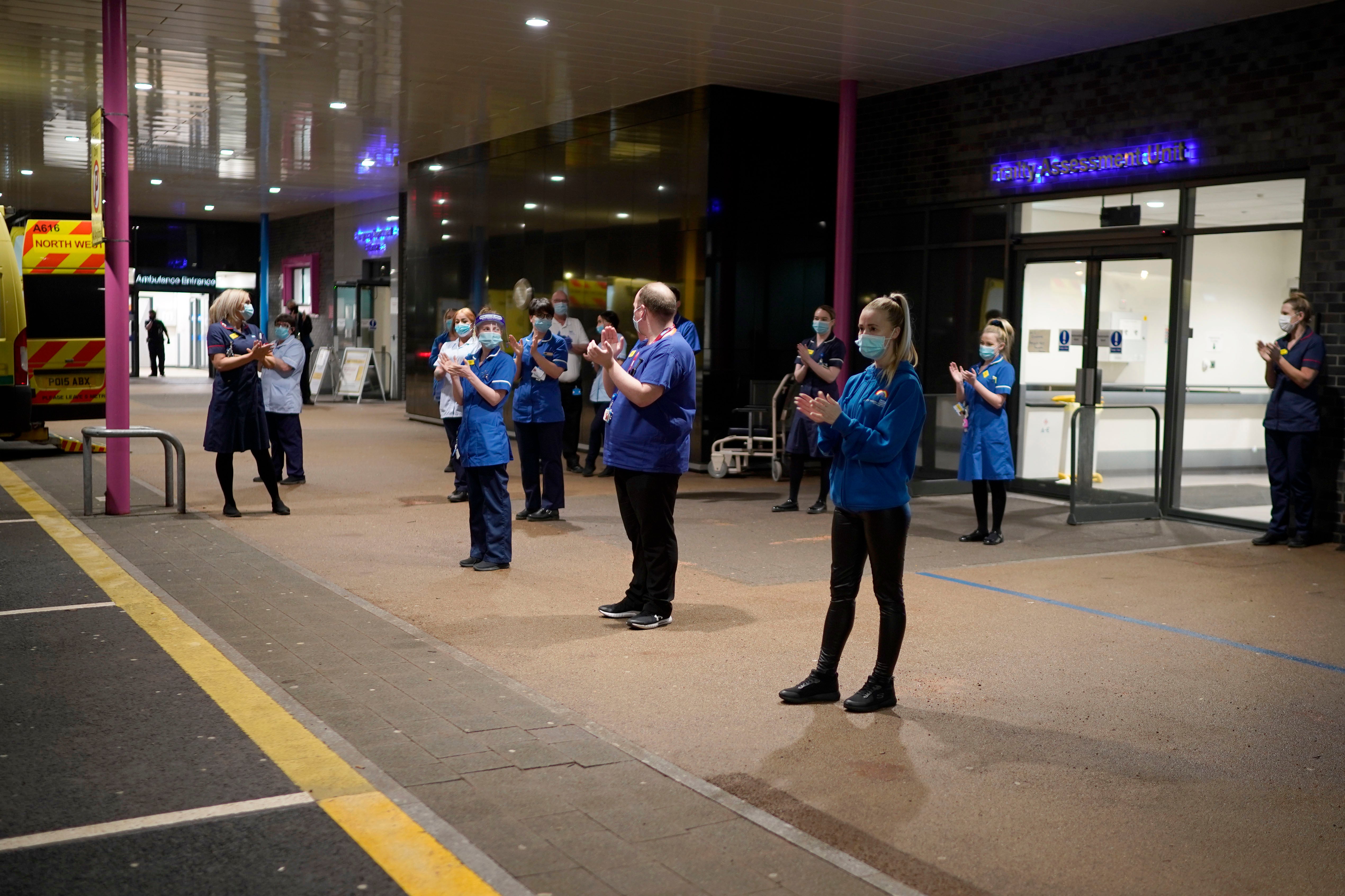 Hospital staff clap in honour of Captain Sir Tom Moore at 6pm outside Aintree Hospital in Liverpool