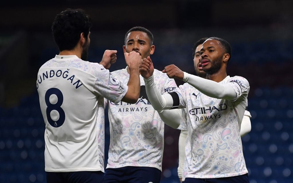 Raheem Sterling celebrates scoring with Gabriel Jesus and Ilkay Gundogan