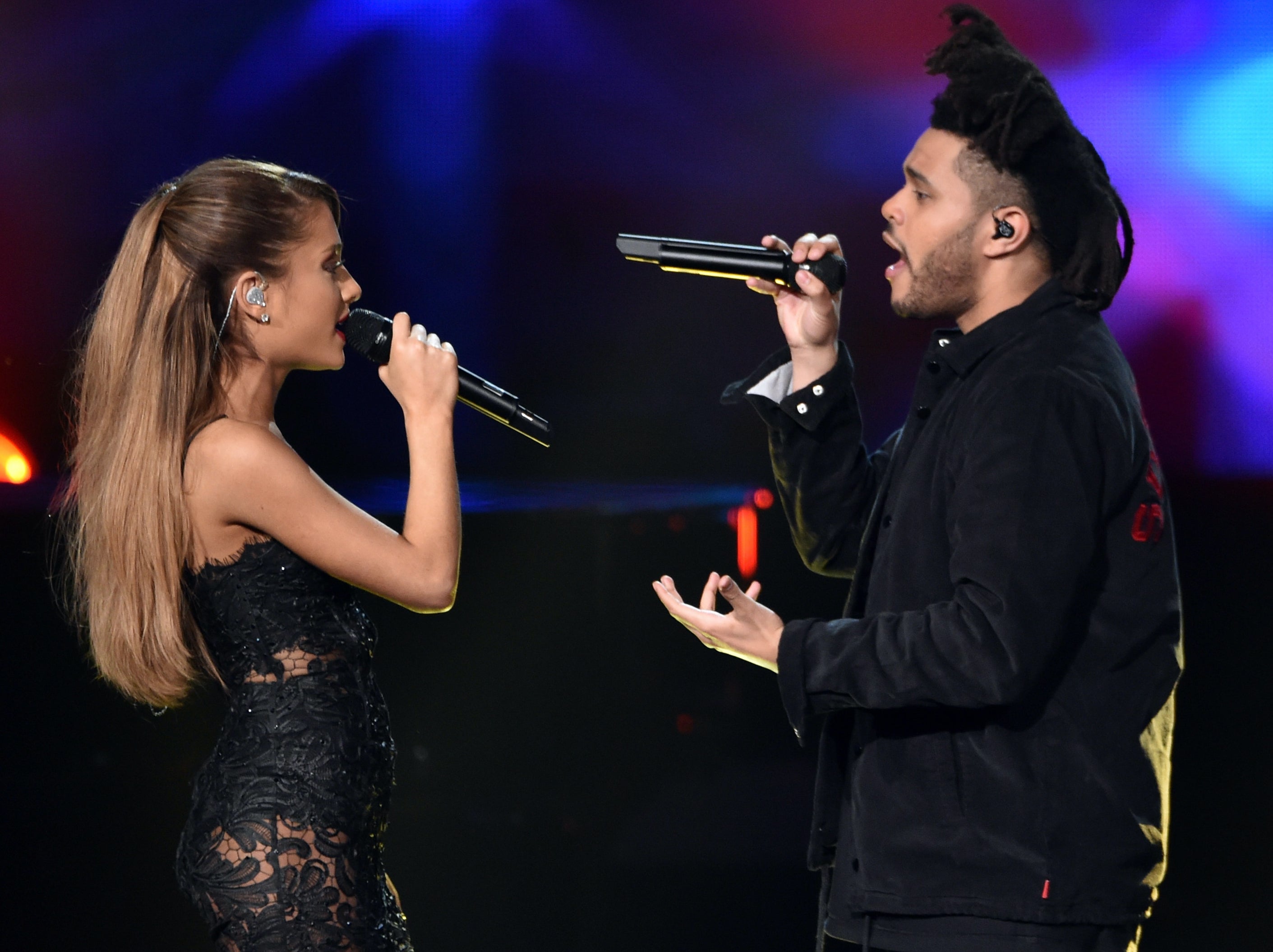 Ariana Grande and The Weeknd performing at the 2014 American Music Awards