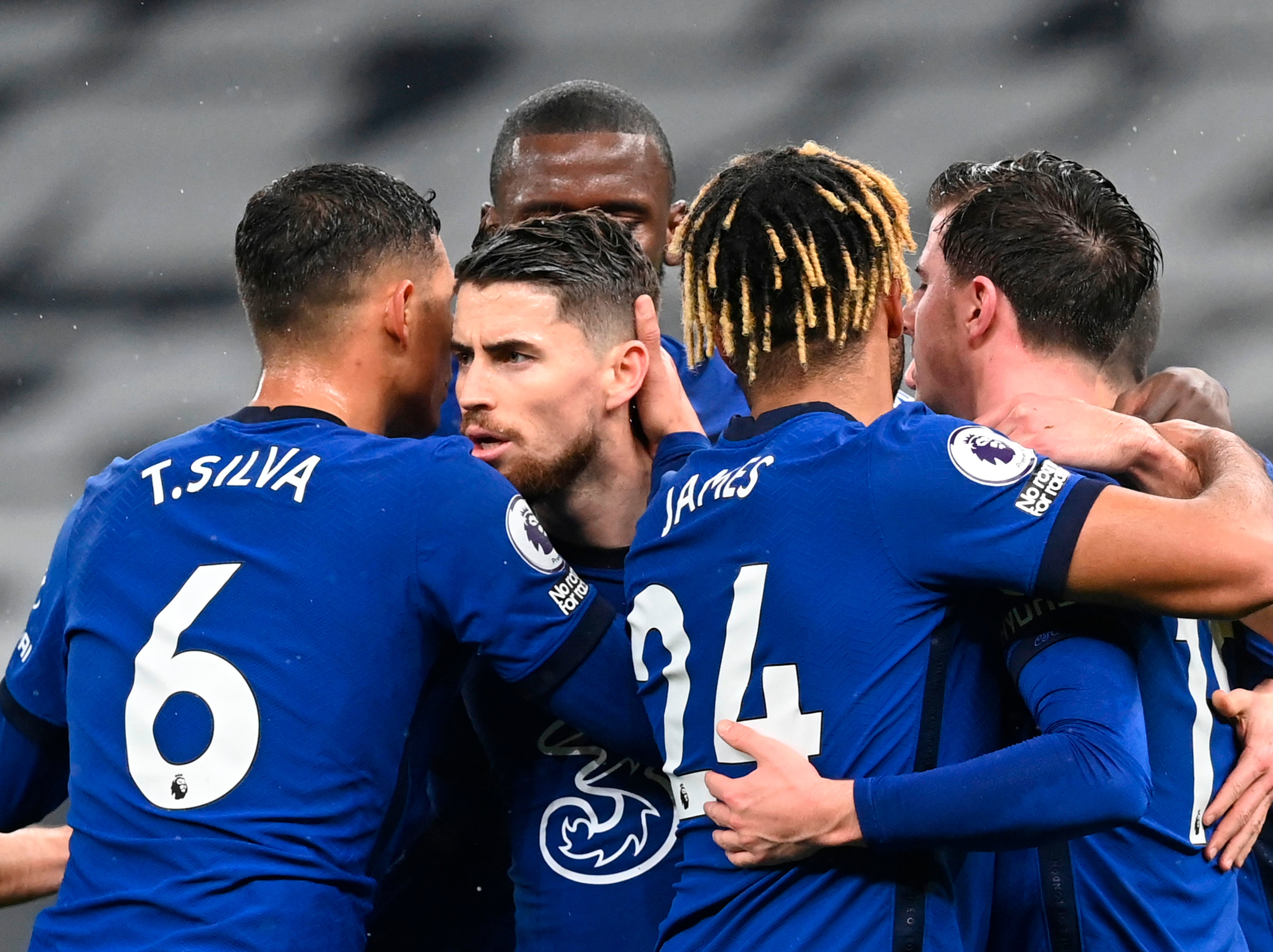 Chelsea players celebrate with goalscorer Jorginho (centre)