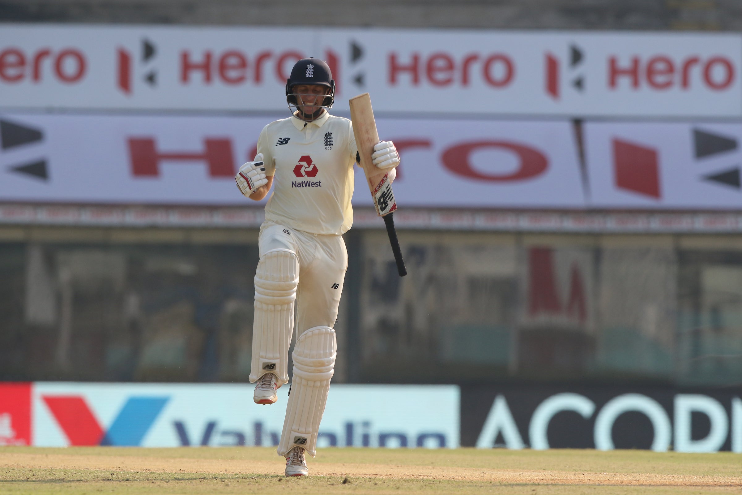 Root celebrates reaching three figures