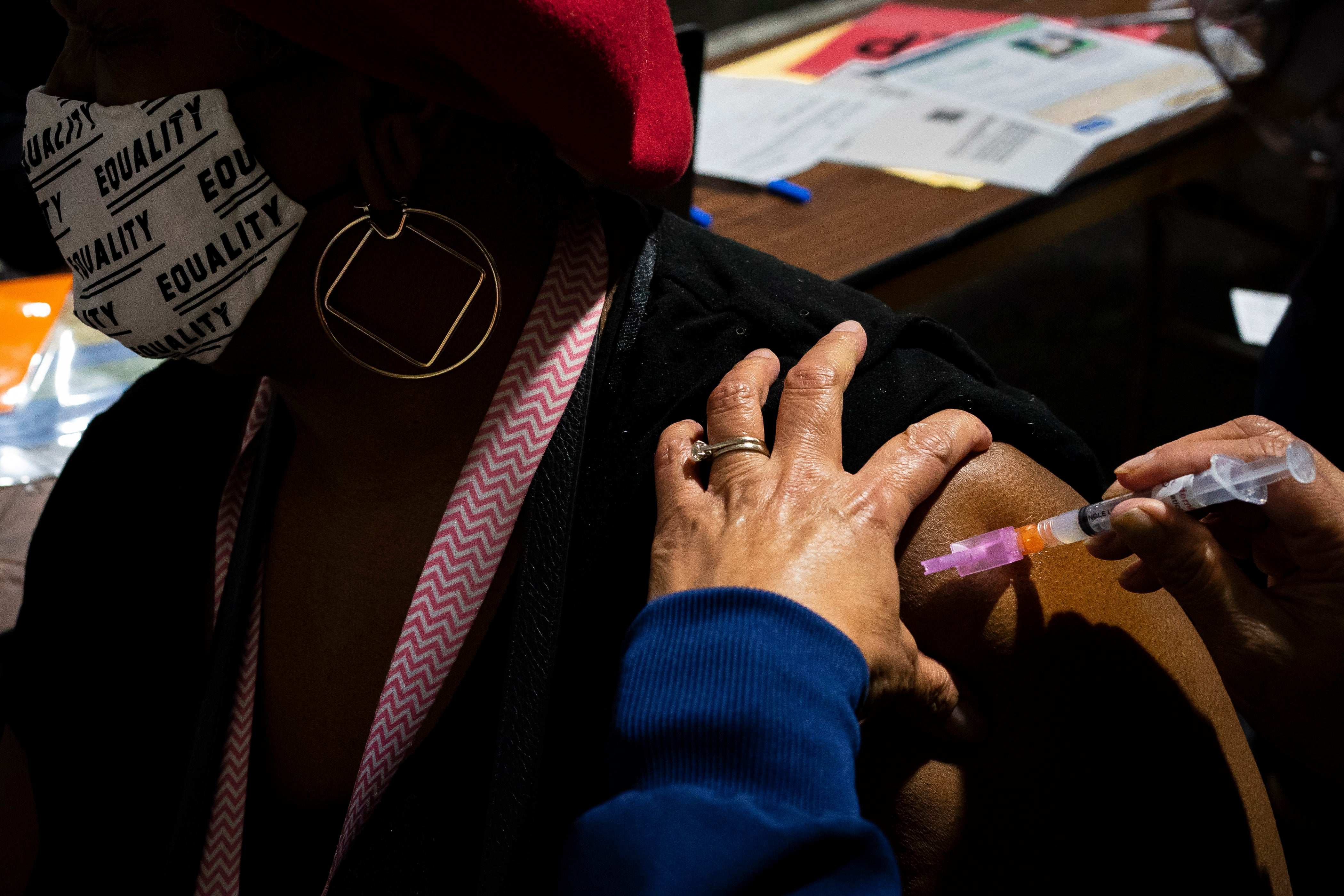 Seattle resident Cheryl Lee receives her vaccination on 4 February 2021 in Federal Way, Washington