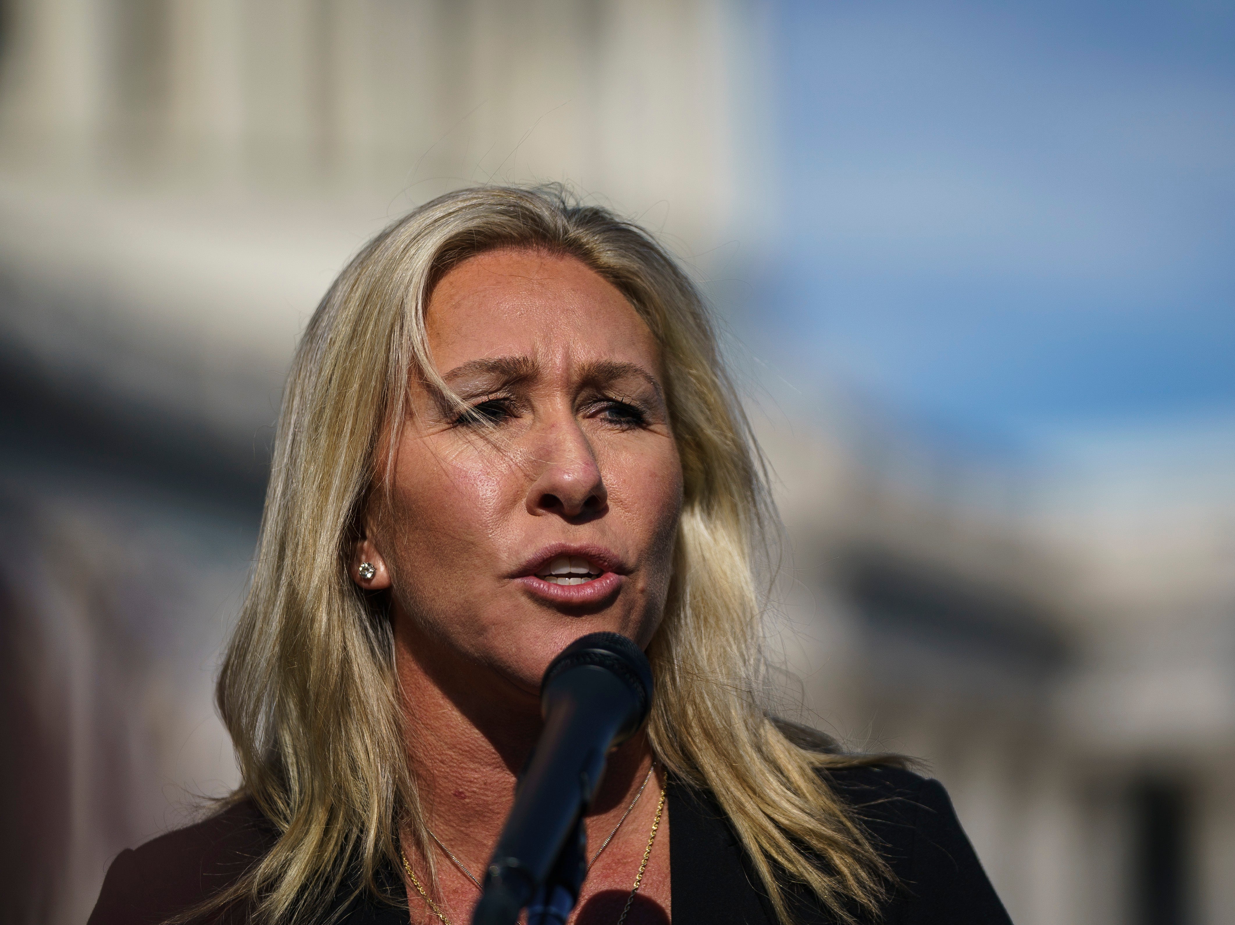 Rep Marjorie Taylor Greene speaks during a press conference outside the US Capitol