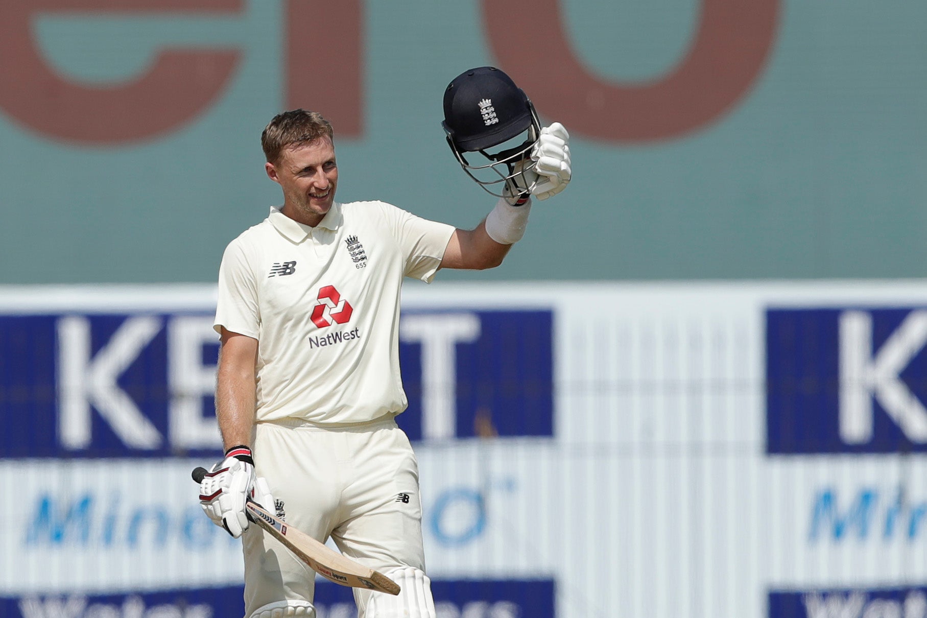 Joe Root celebrates scoring a century