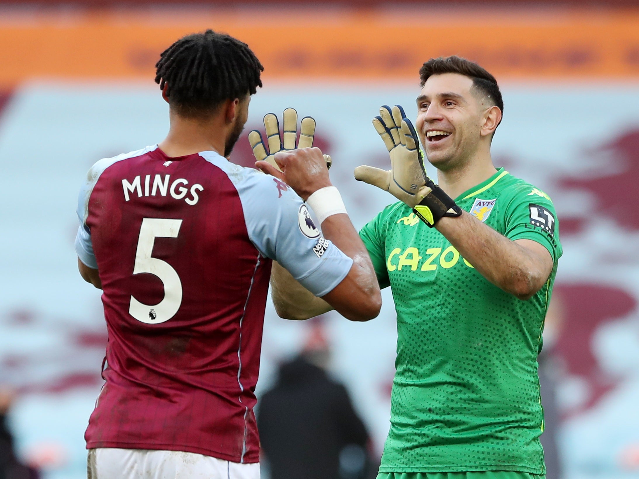 Tyrone Mings celebrates with Emi Martinez at full-time