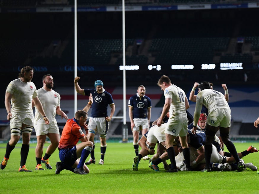 Scotland celebrate after scoring a try