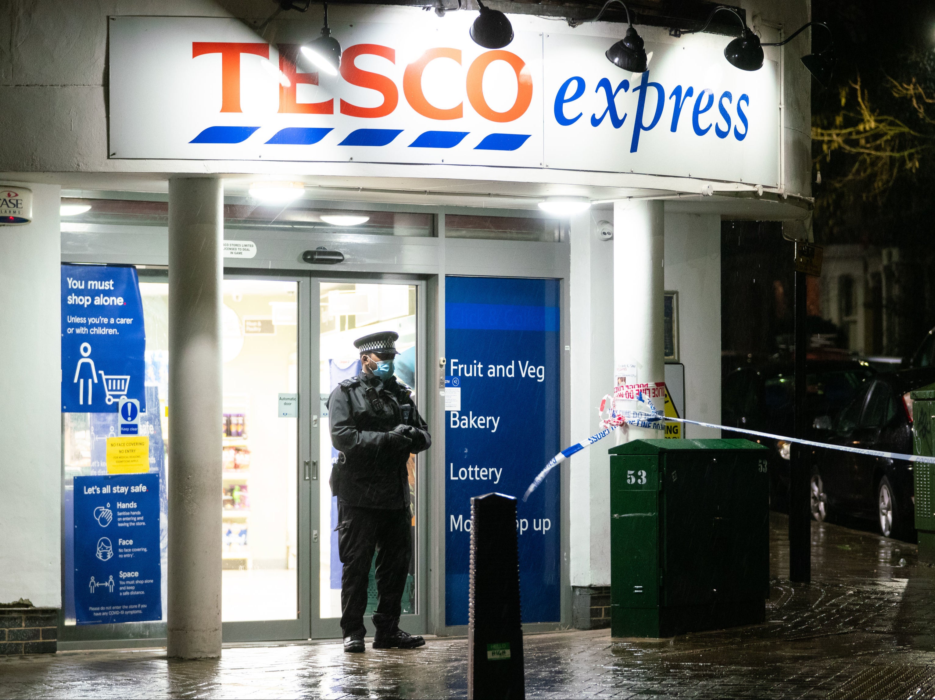 Police at the scene of a stabbing incident on Willesden Lane, in Kilburn, north-west London, where one man has died and another is in a critical condition after a stabbing incident.