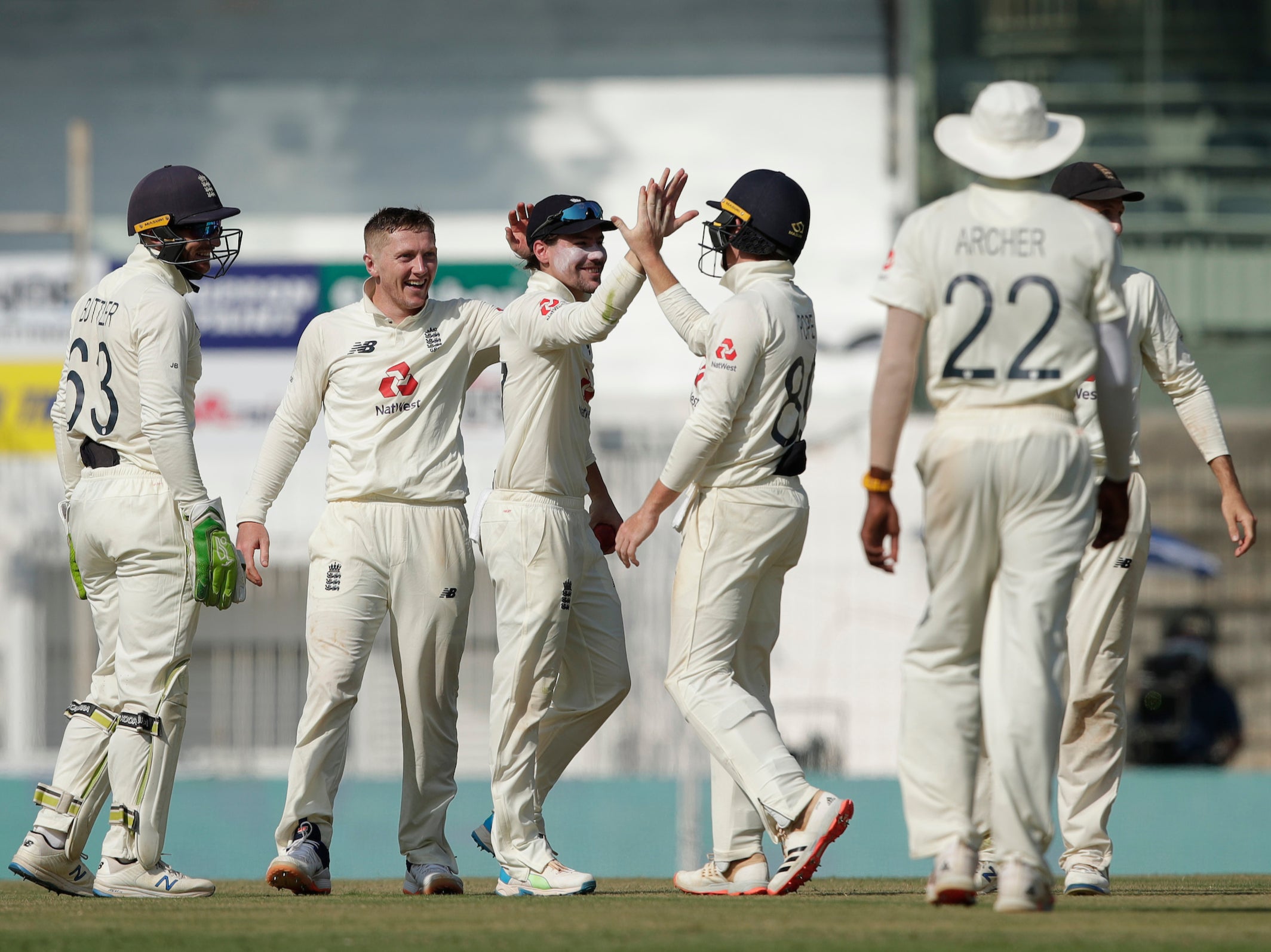 England team celebrates the wicket of Cheteshwar Pujara on day three