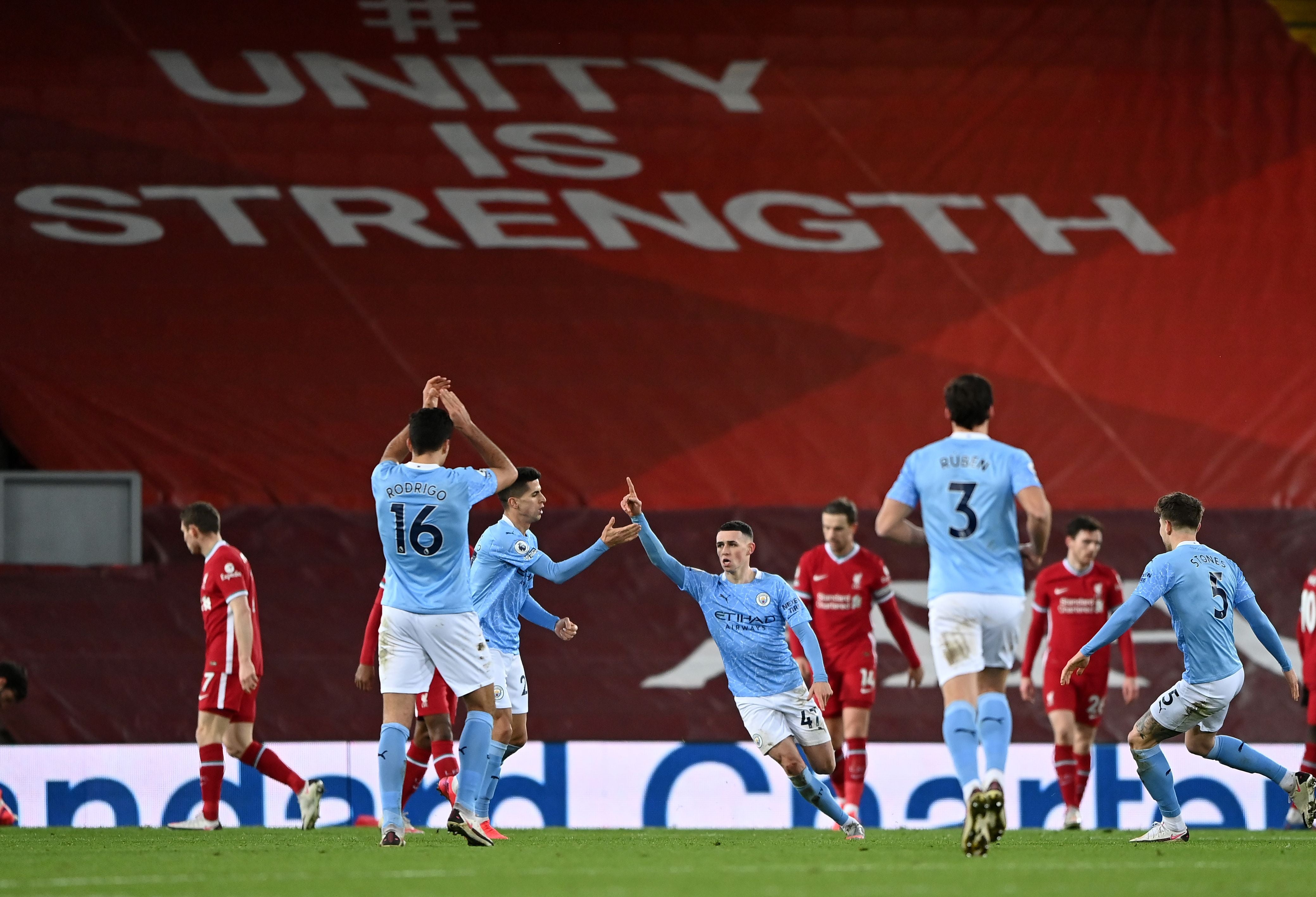 Phil Foden (centre) celebrates a fine goal