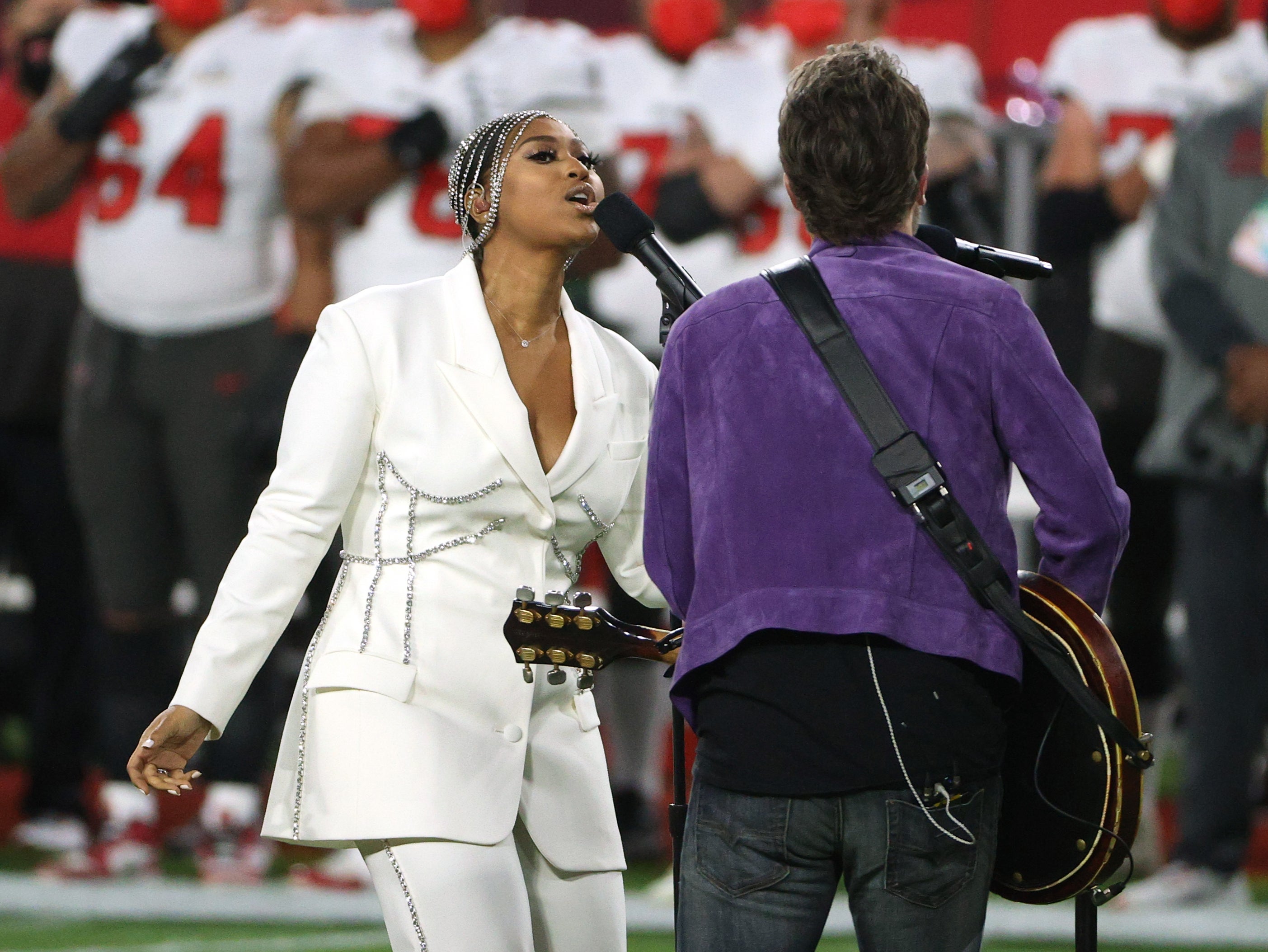 Jazmine Sullivan and Eric Church perform the national anthem before Super Bowl LV