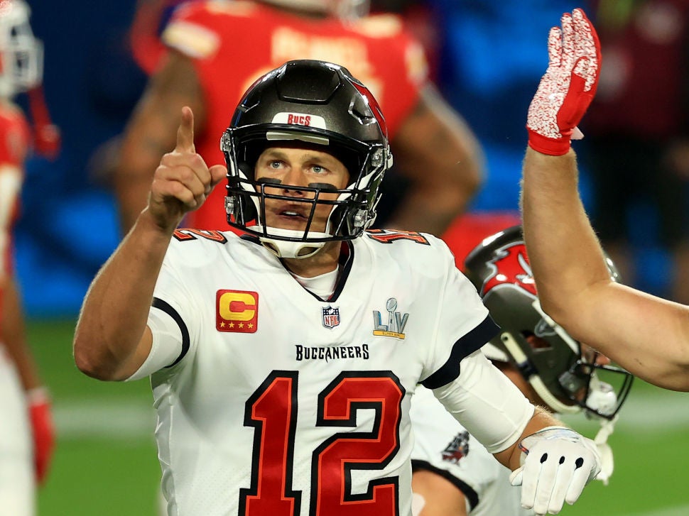 Tom Brady celebrates a 27-yard touchdown run by Leonard Fournette