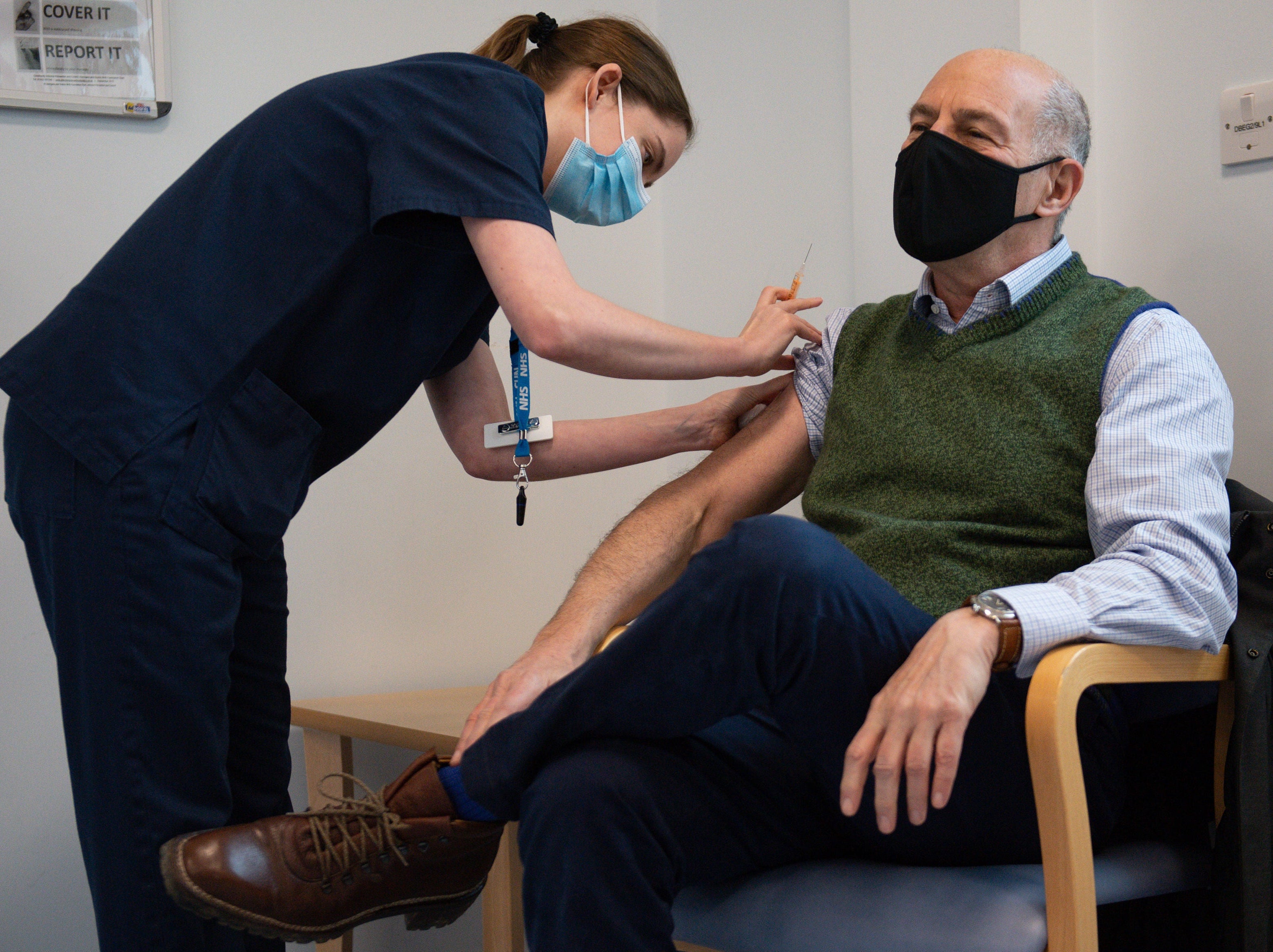 Covid news – live: UK cases drop to pre-Christmas levels as fears grow over South African variant