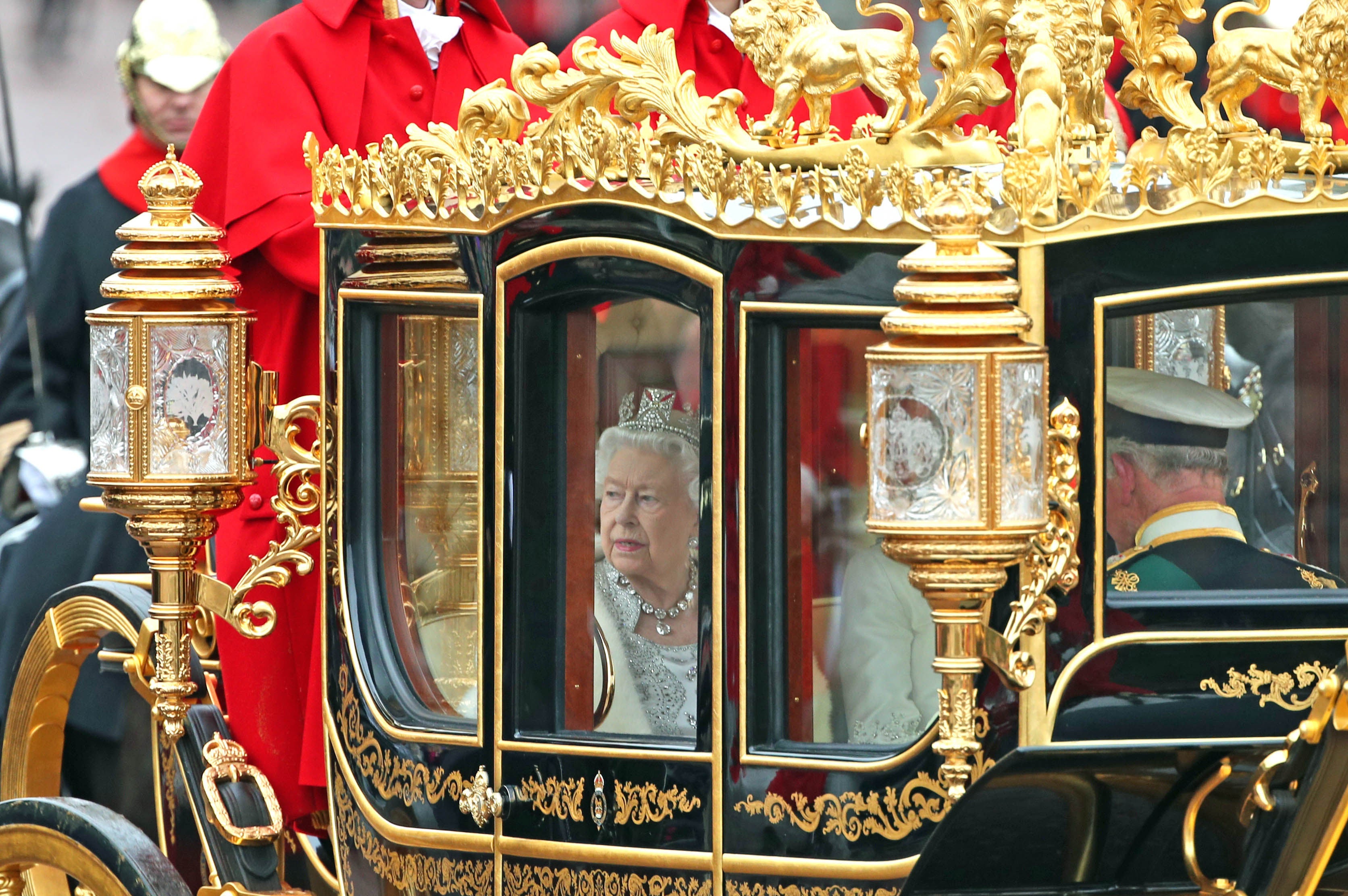 The Queen, accompanied by the Duke and Duchess of Cornwall, returning to Buckingham Palace in the Diamond Jubilee State Coach, having delivered The Queen’s Speech in 2019