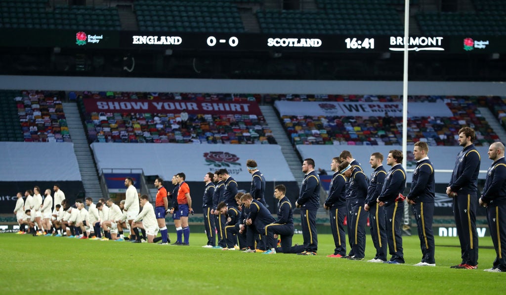 The teams line up for the Rugby Against Racism campaign during the Guinness Six Nations match between England and Scotland at Twickenham