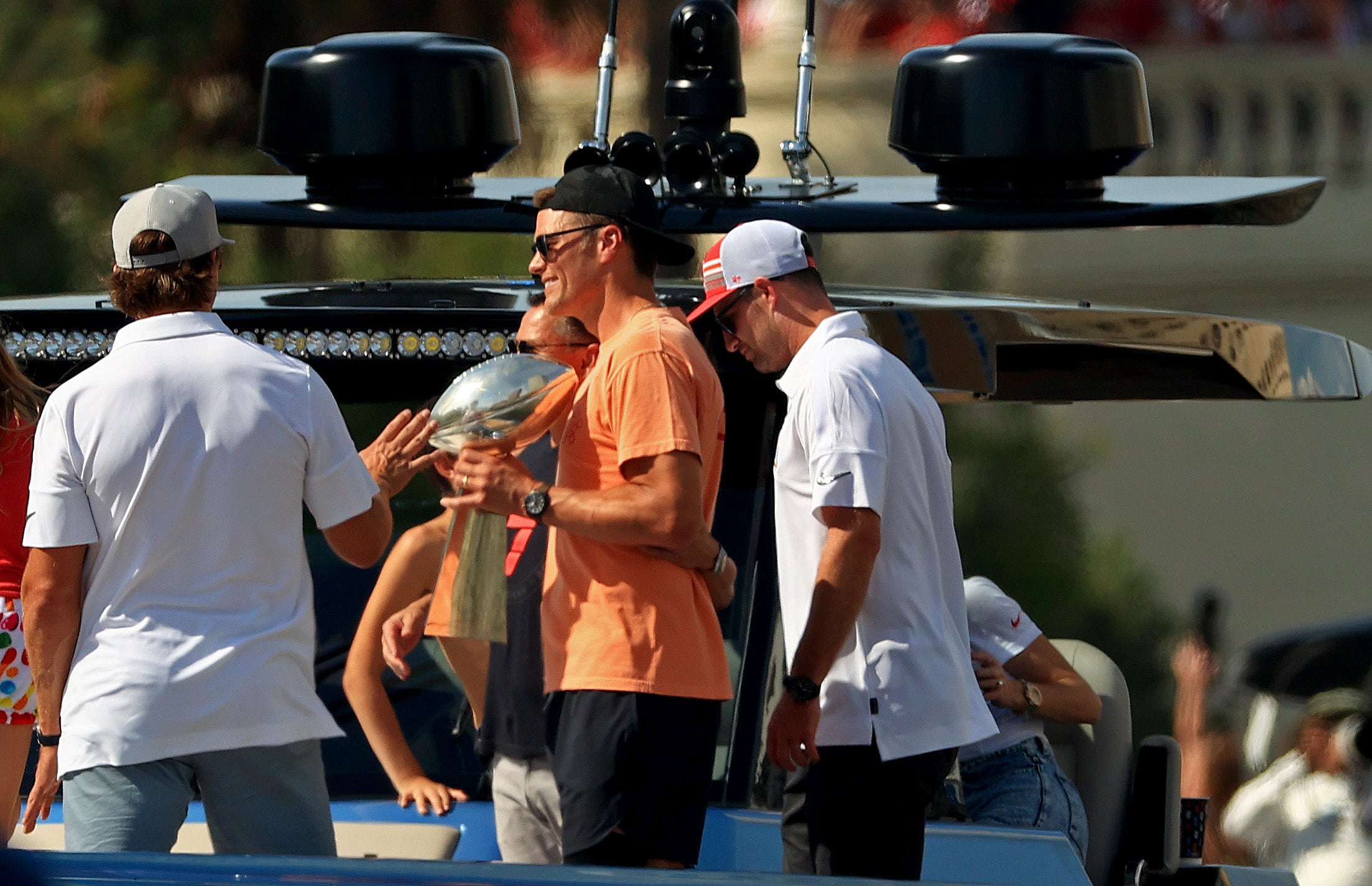 Tom Brady tosses Lombardi Trophy off boat at floating Super Bowl victory parade