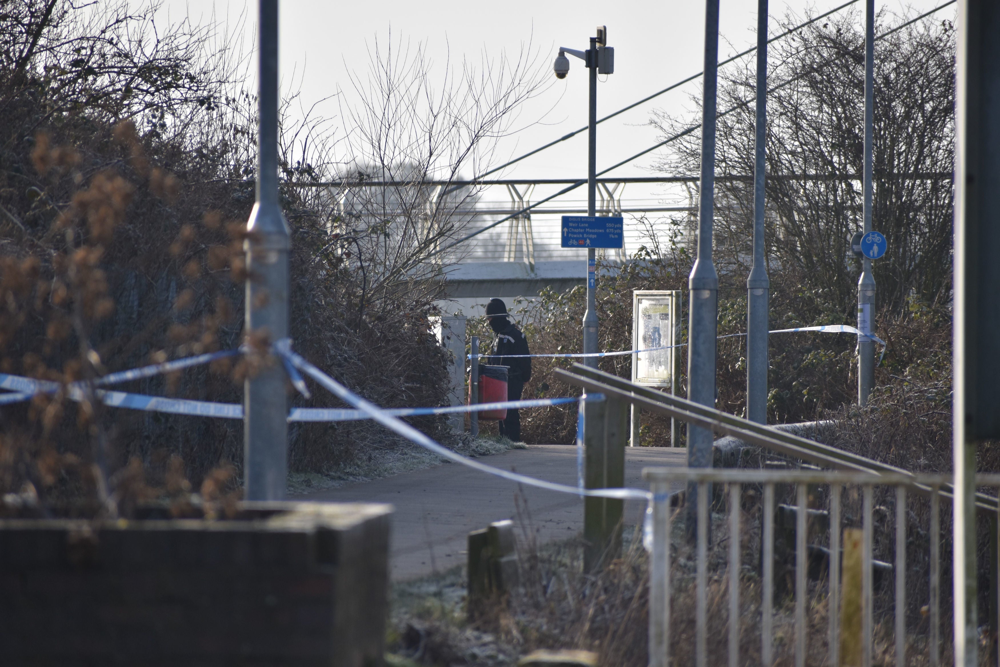 A police cordon near the Diglis footbridge in Worcester, where specialist teams are searching a stretch of the River Severn after a man was arrested on suspicion of murder