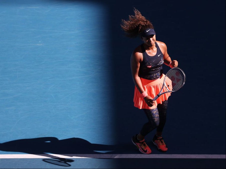 Naomi Osaka celebrates defeating Ons Jabeur