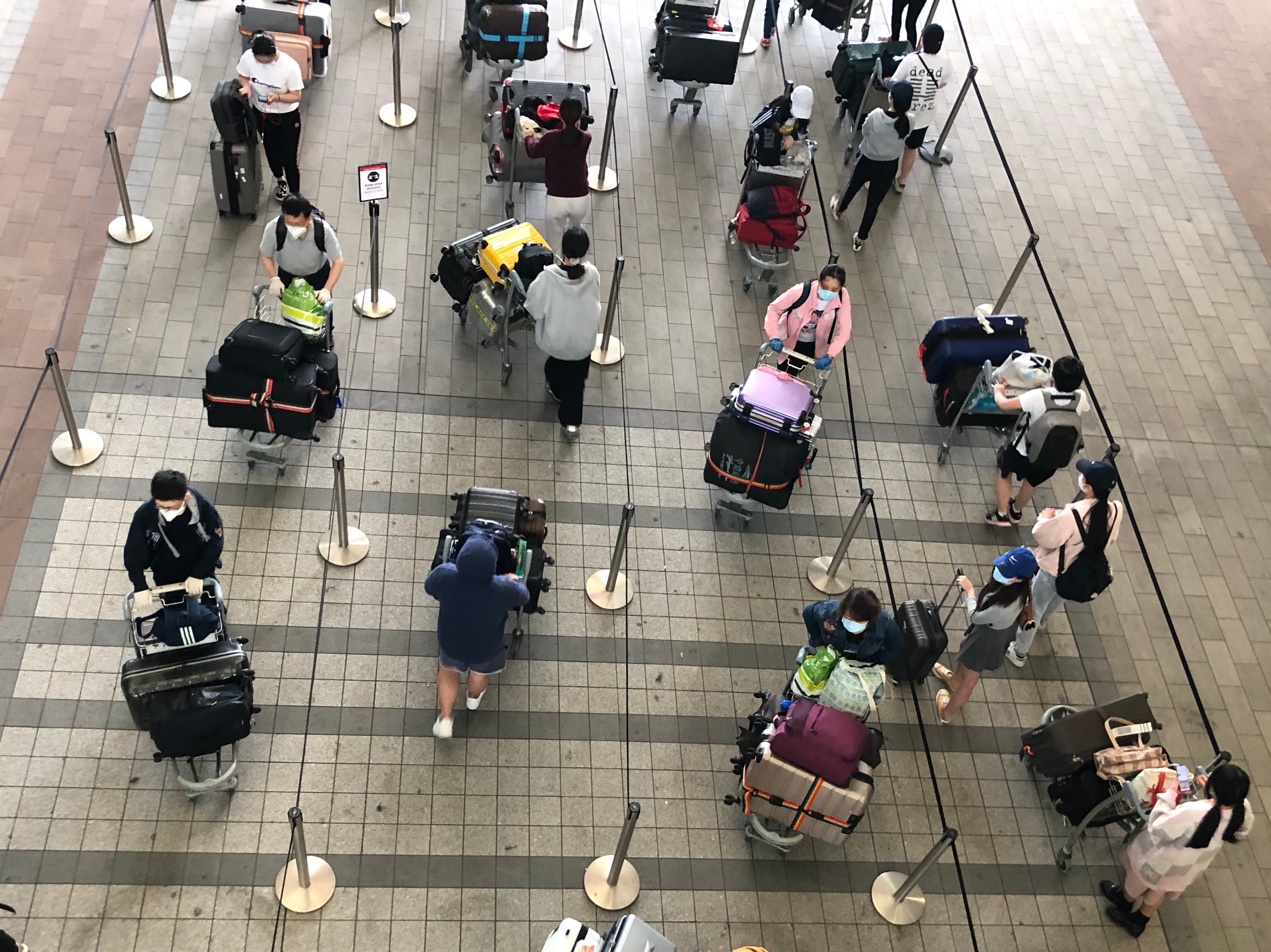 Waiting game: passengers at Heathrow airport